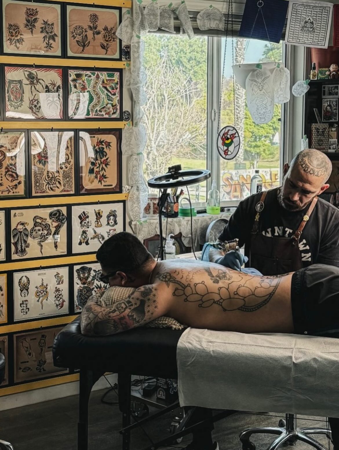 Bear and flowers American traditional tattoo on the back by Mikey Montoya