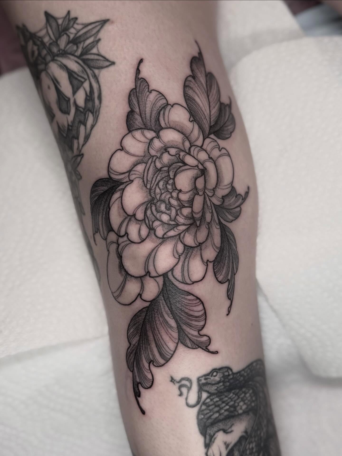 Peony black and grey tattoo on the forearm by Cincinnati