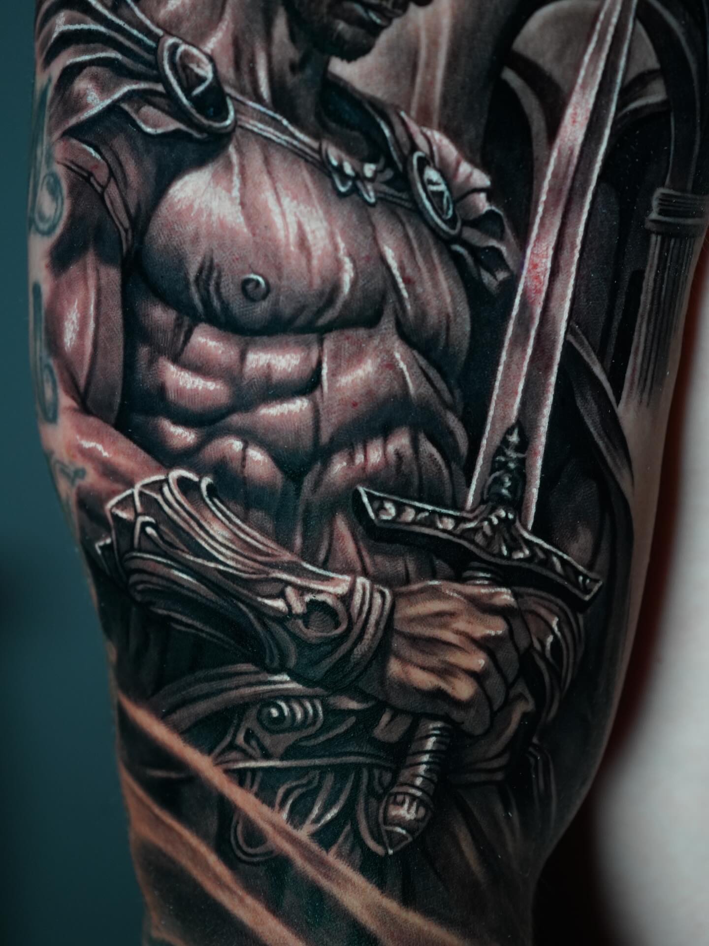 Muscular warrior realism tattoo on the forearm by Edgar Campaña
