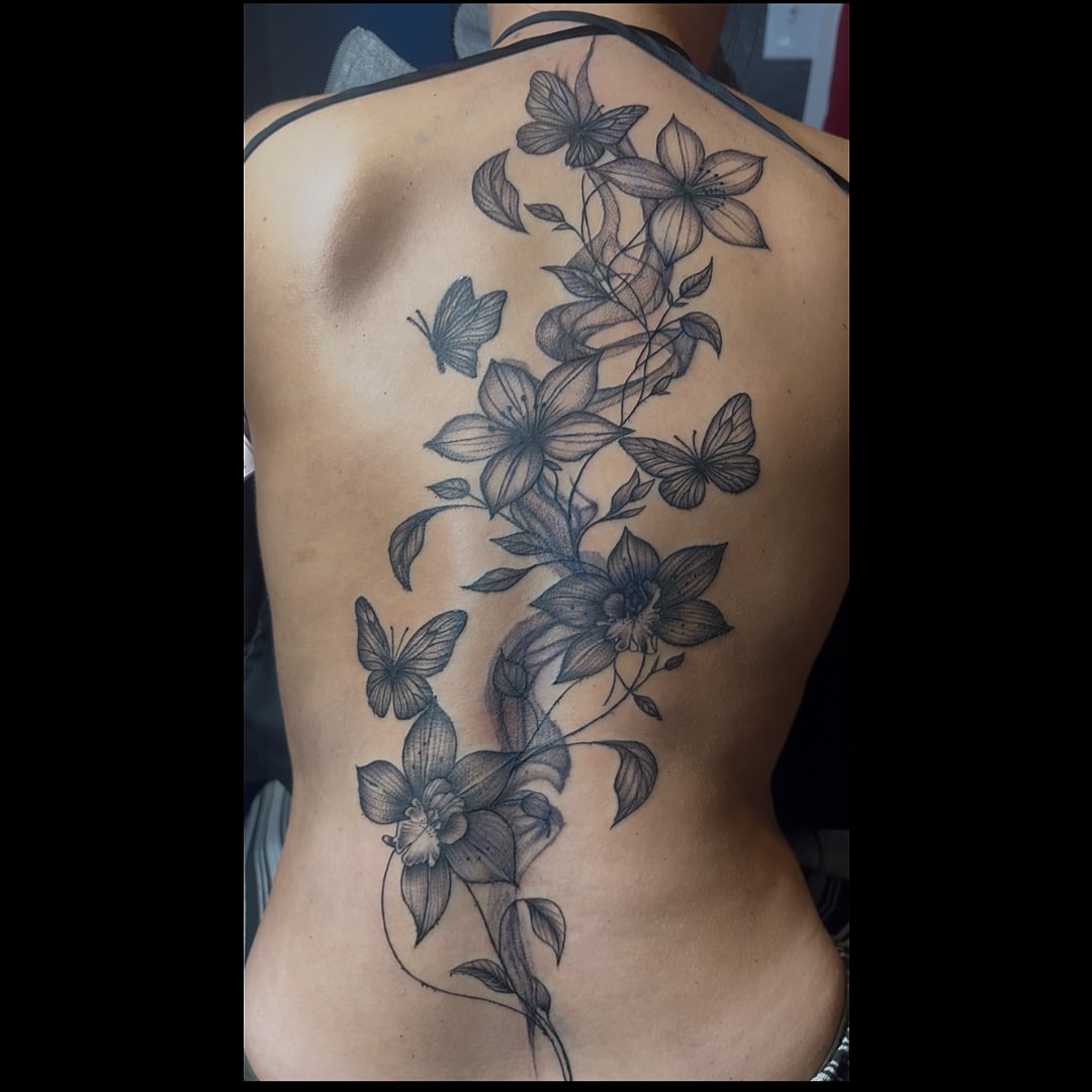 Flowers and butterflies black and grey tattoo on the back by 𝔾𝔥𝓸ş𝔱
