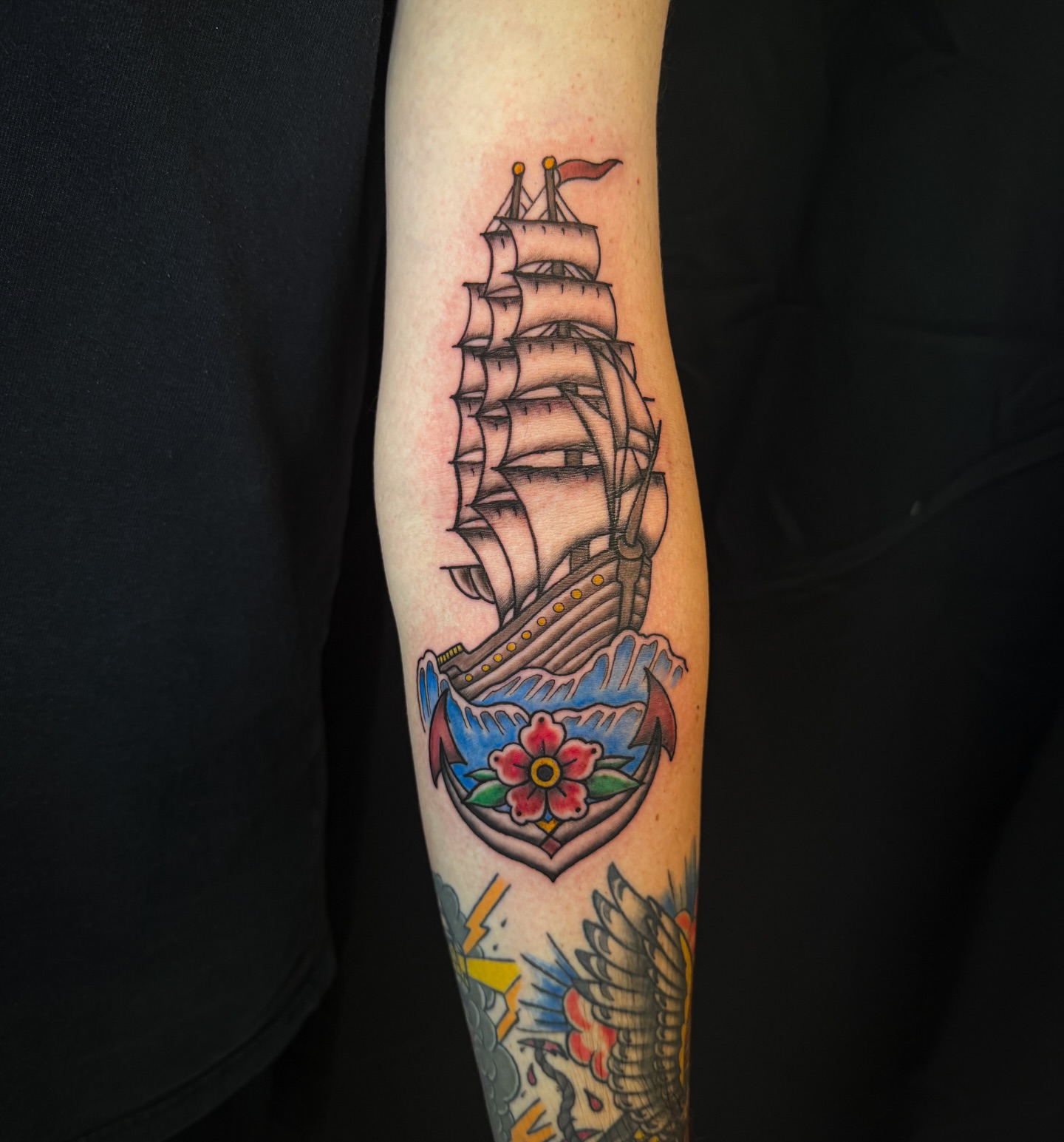 Ship and flower American traditional tattoo on the forearm by utah tattoo artist