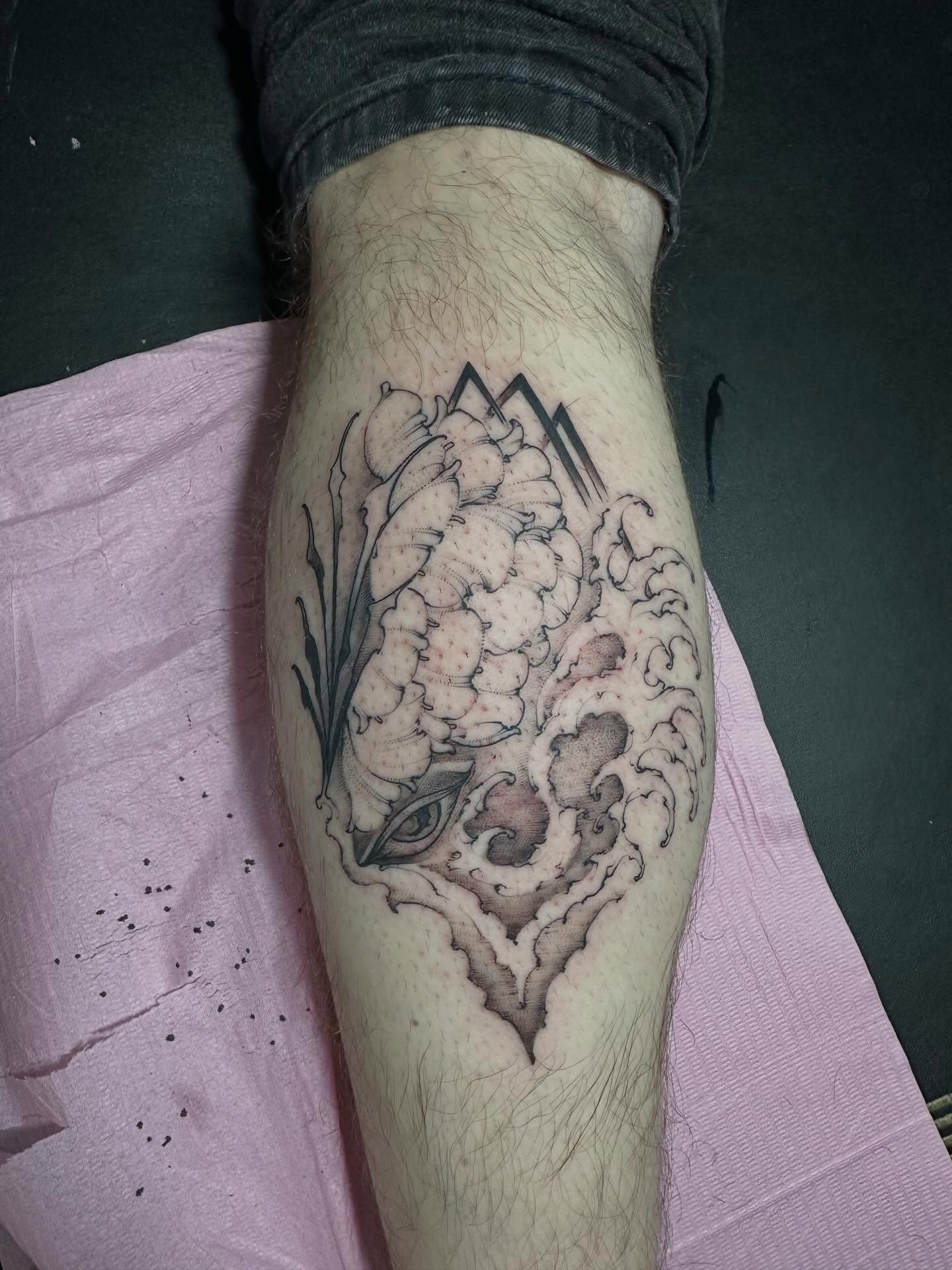 Peony and mountain black and grey tattoo on the forearm by Dallas Davis