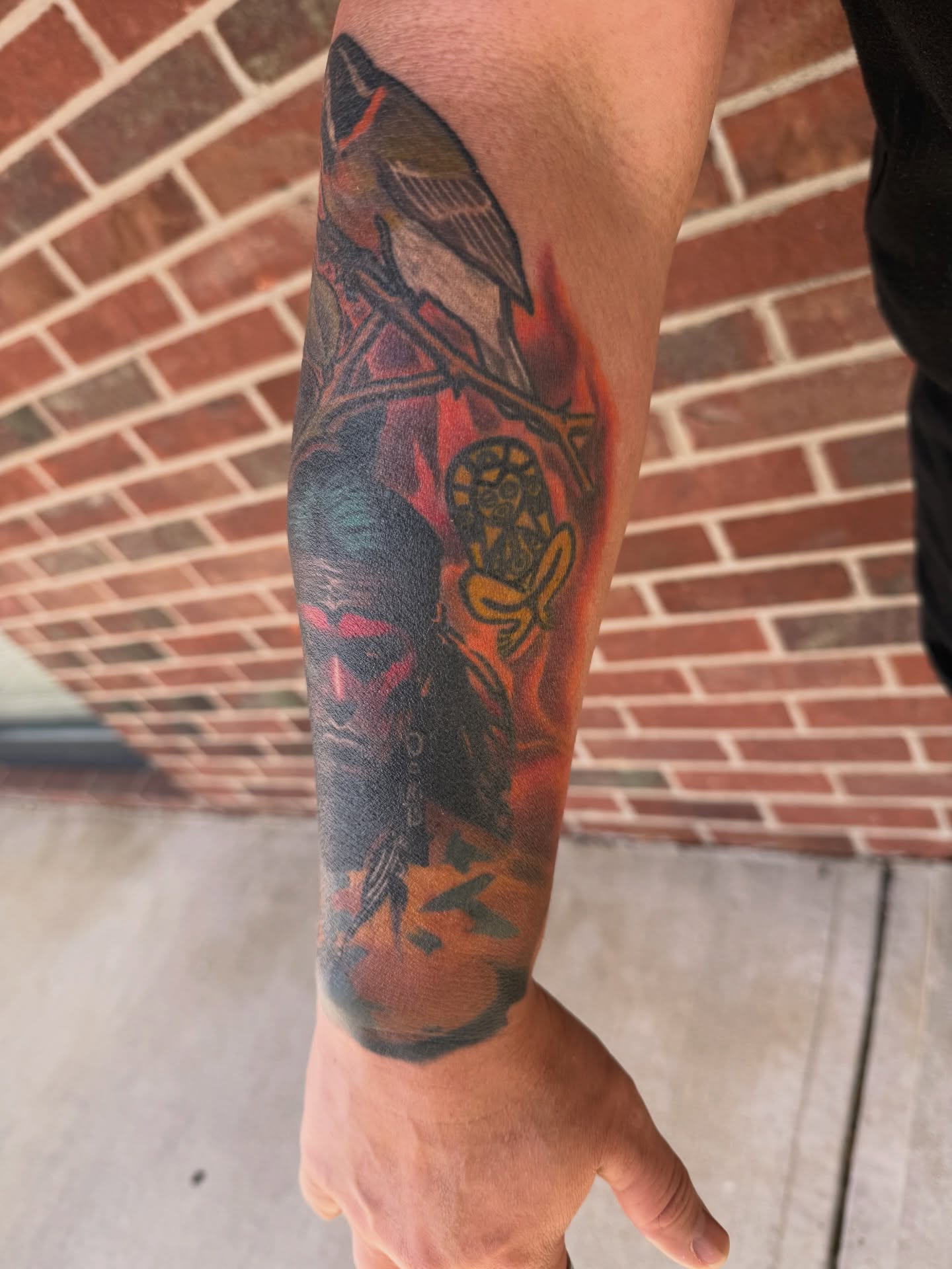 Bird and flower American traditional tattoo on the forearm by Ignacio José Sweeney Rolón Bas Santa Cruz