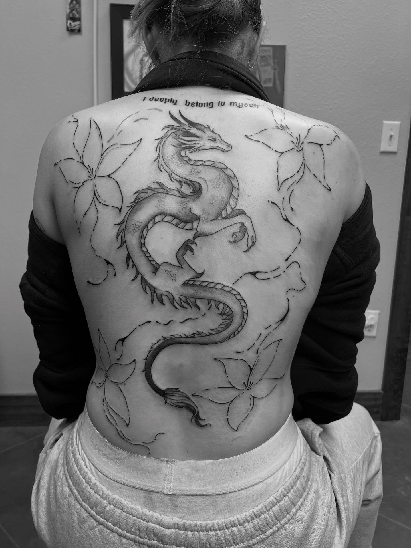 Dragon black and grey tattoo on the back by Rebecca Kern Tattoos