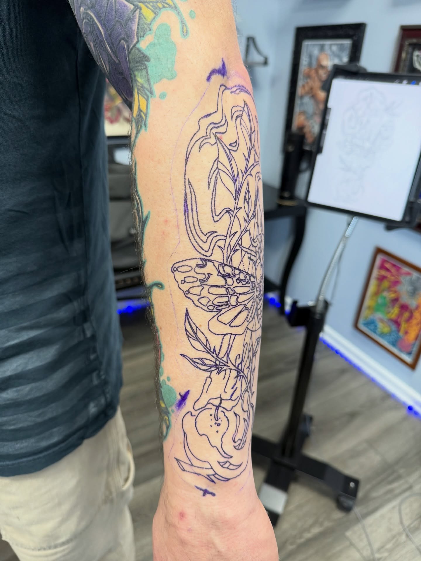 Floral and butterfly fine line tattoo on the forearm by Ignacio José Sweeney Rolón Bas Santa Cruz
