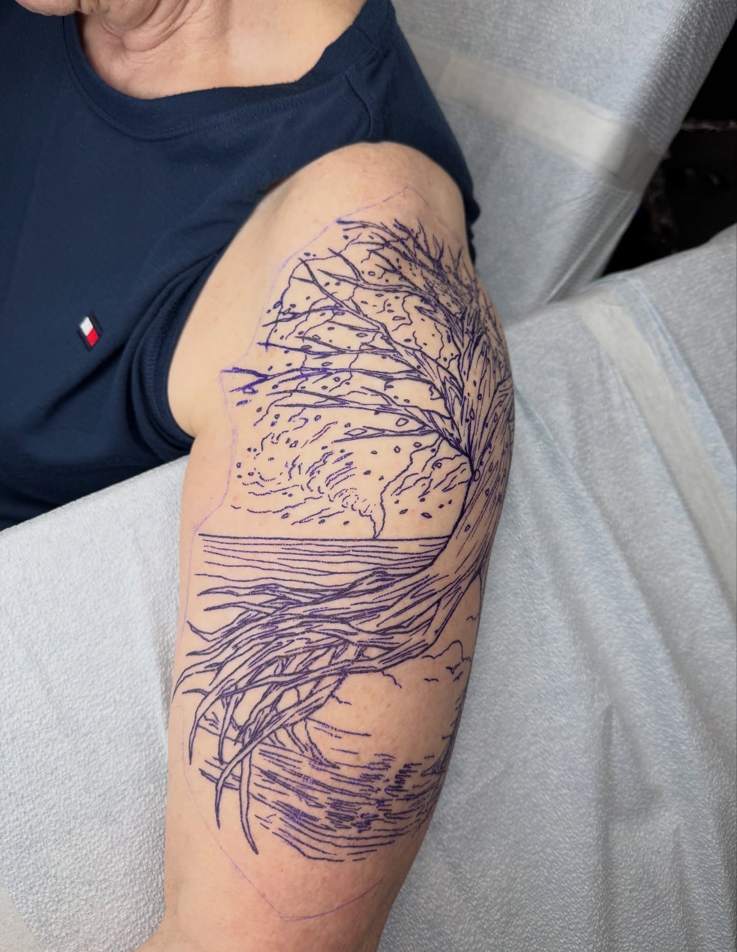 Tree and landscape fine line tattoo on the upper arm by Ignacio José Sweeney Rolón Bas Santa Cruz