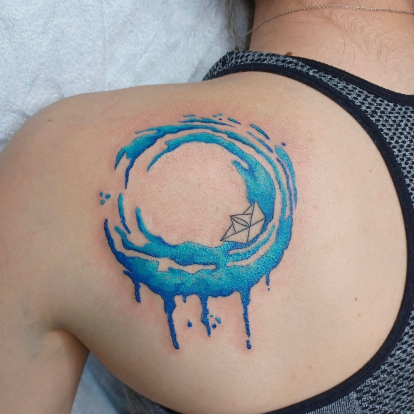 Water droplet geometric tattoo on the shoulder by Chris Bell