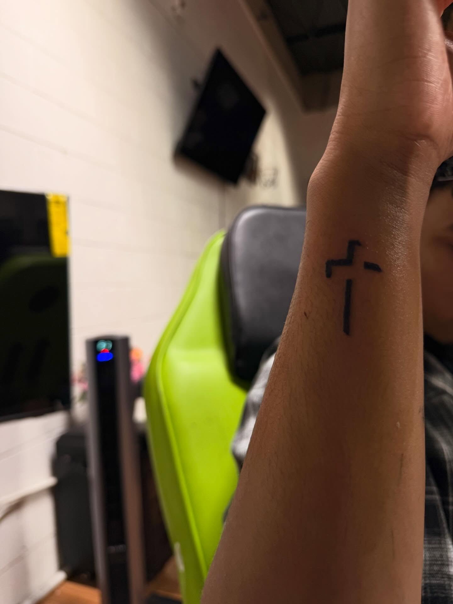 Cross minimalist tattoo on the forearm by Ms Thick