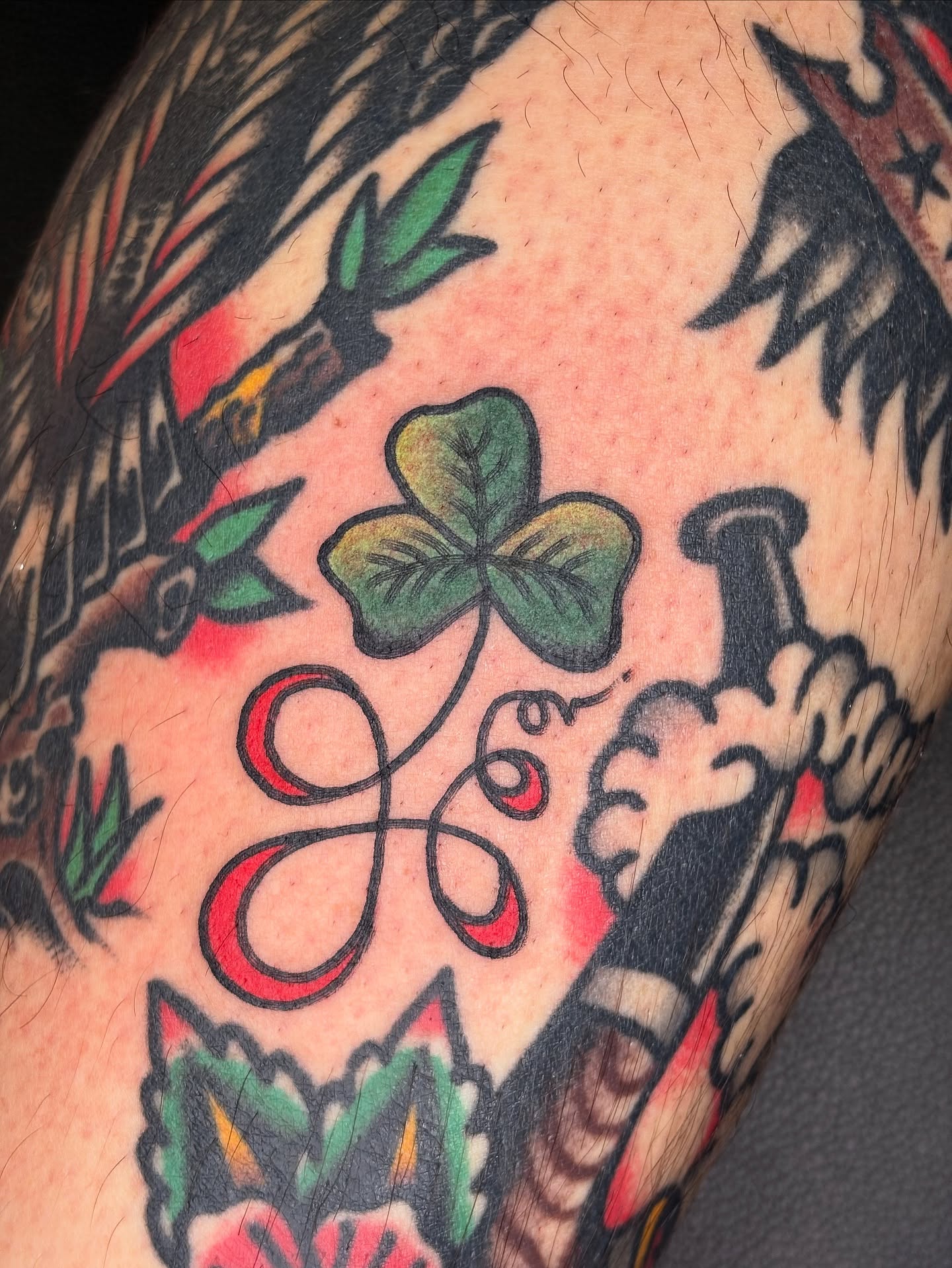 Clover and knot American traditional tattoo on the forearm by Andrew Silva