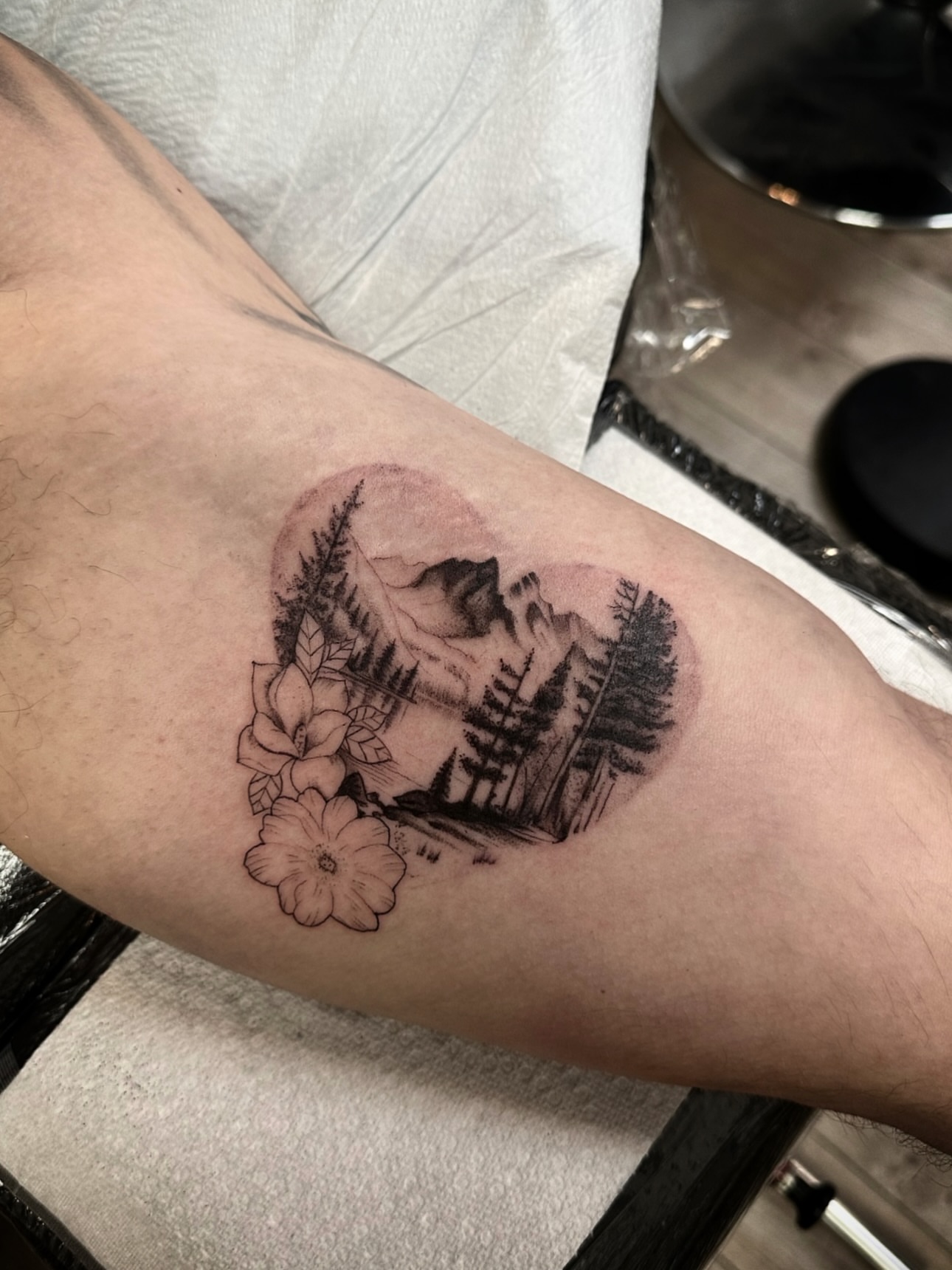 Mountain landscape black and grey tattoo on the forearm by Matt Kearney