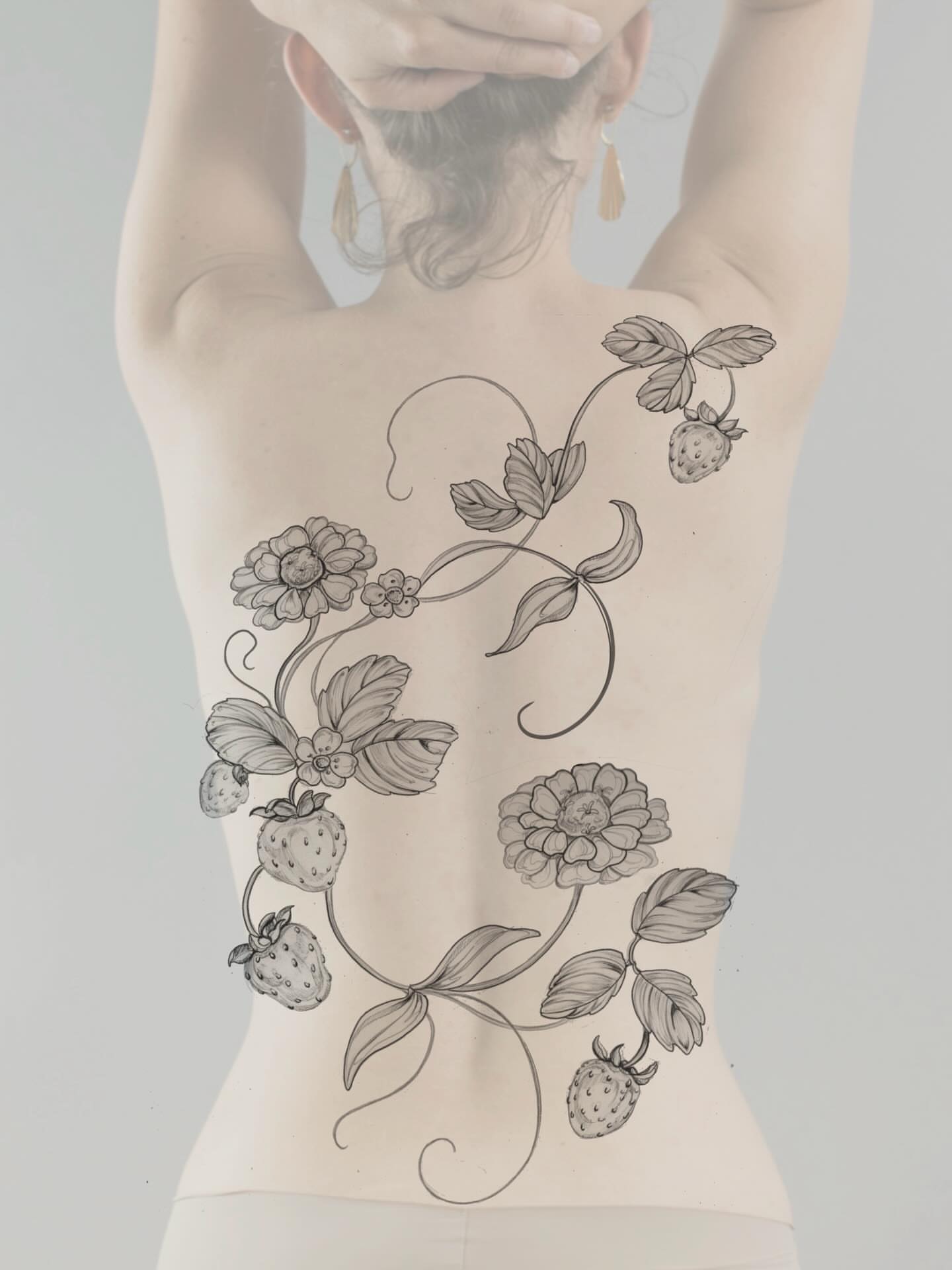 Strawberries and flowers ornamental tattoo on the torso by Sierra Skye