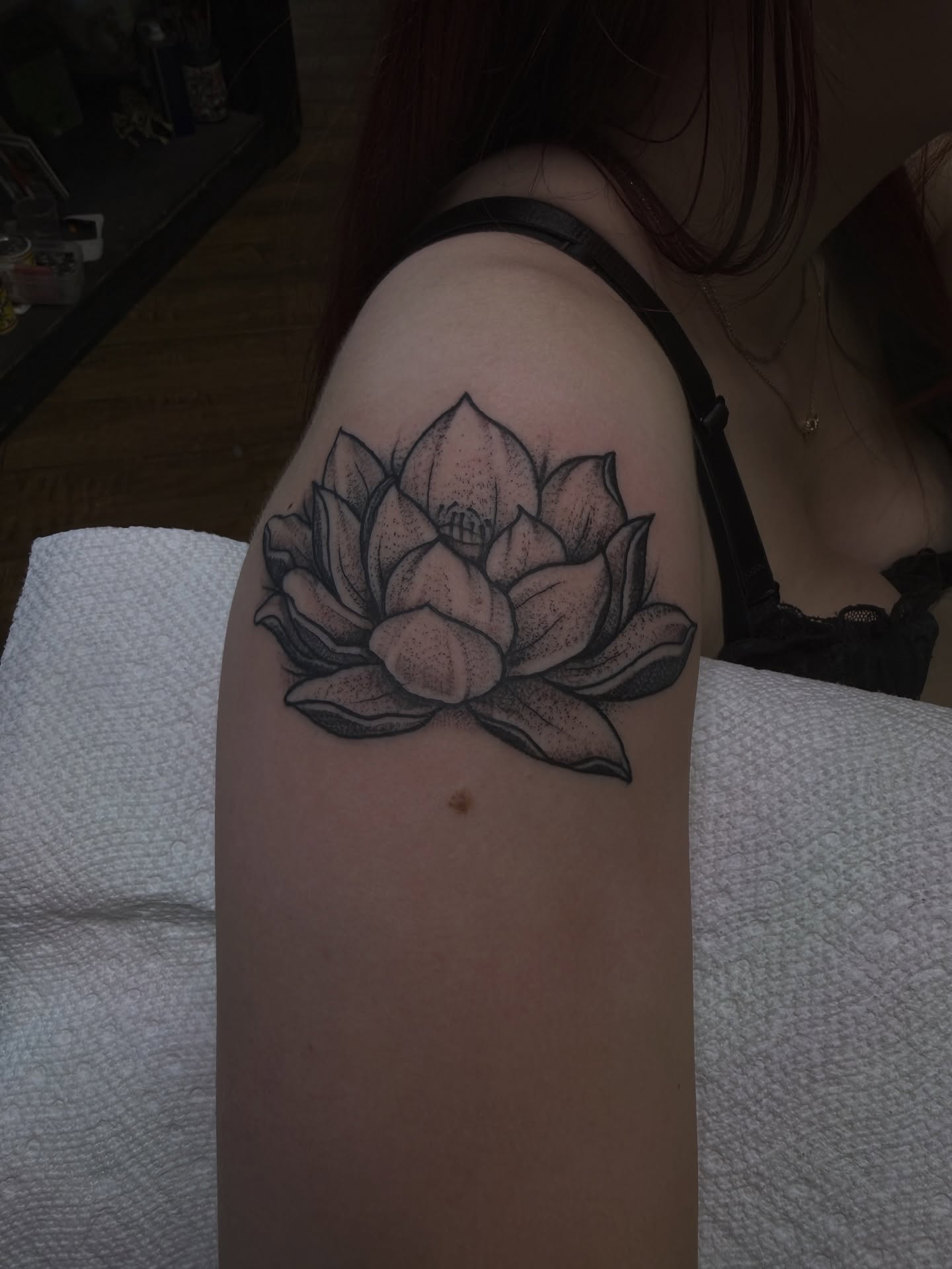 Lotus flower dotwork tattoo on the thigh by Ramón Silva