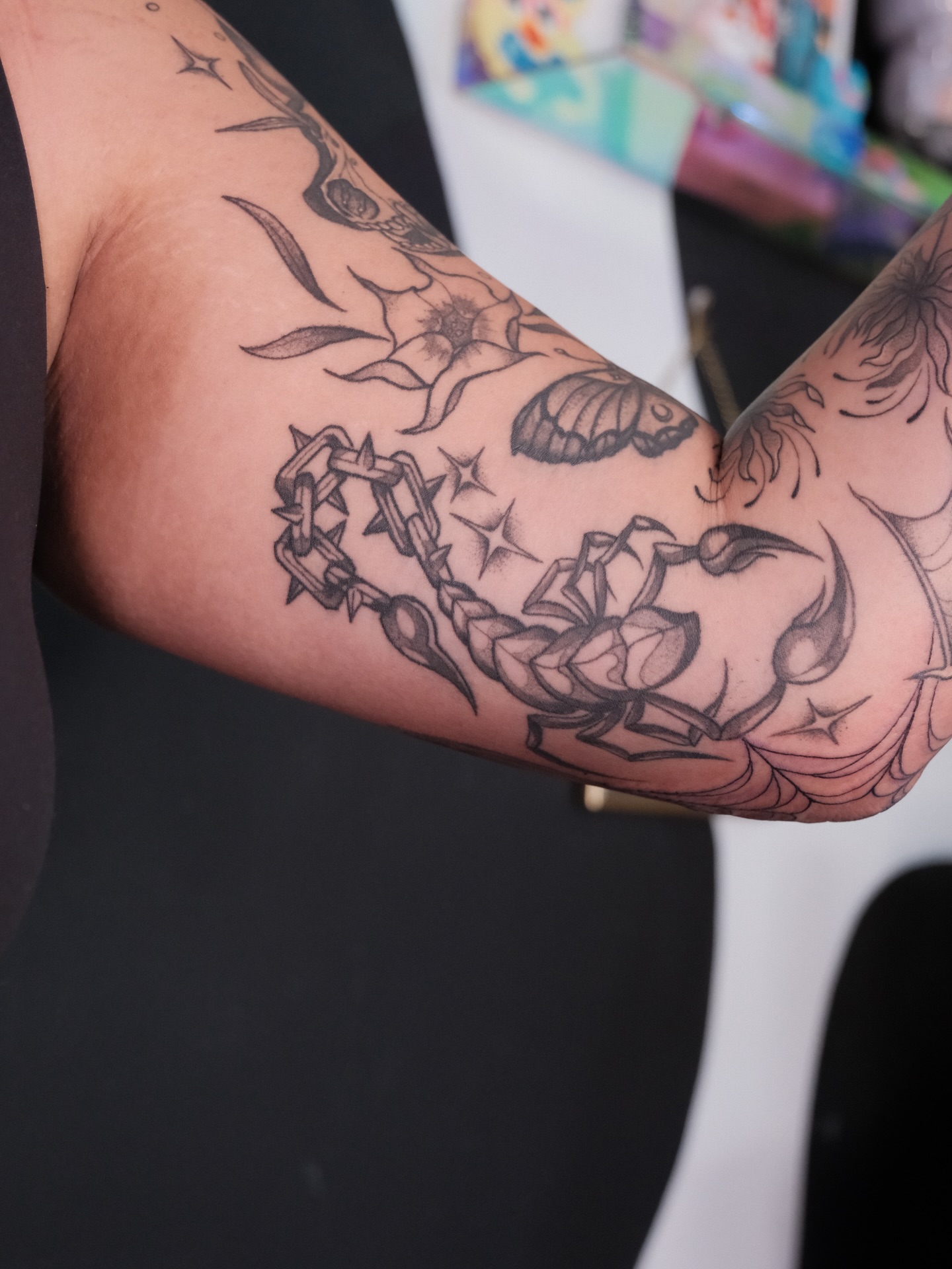 Scorpion and chain American traditional tattoo on the forearm by Velvet, Seattle, Washington