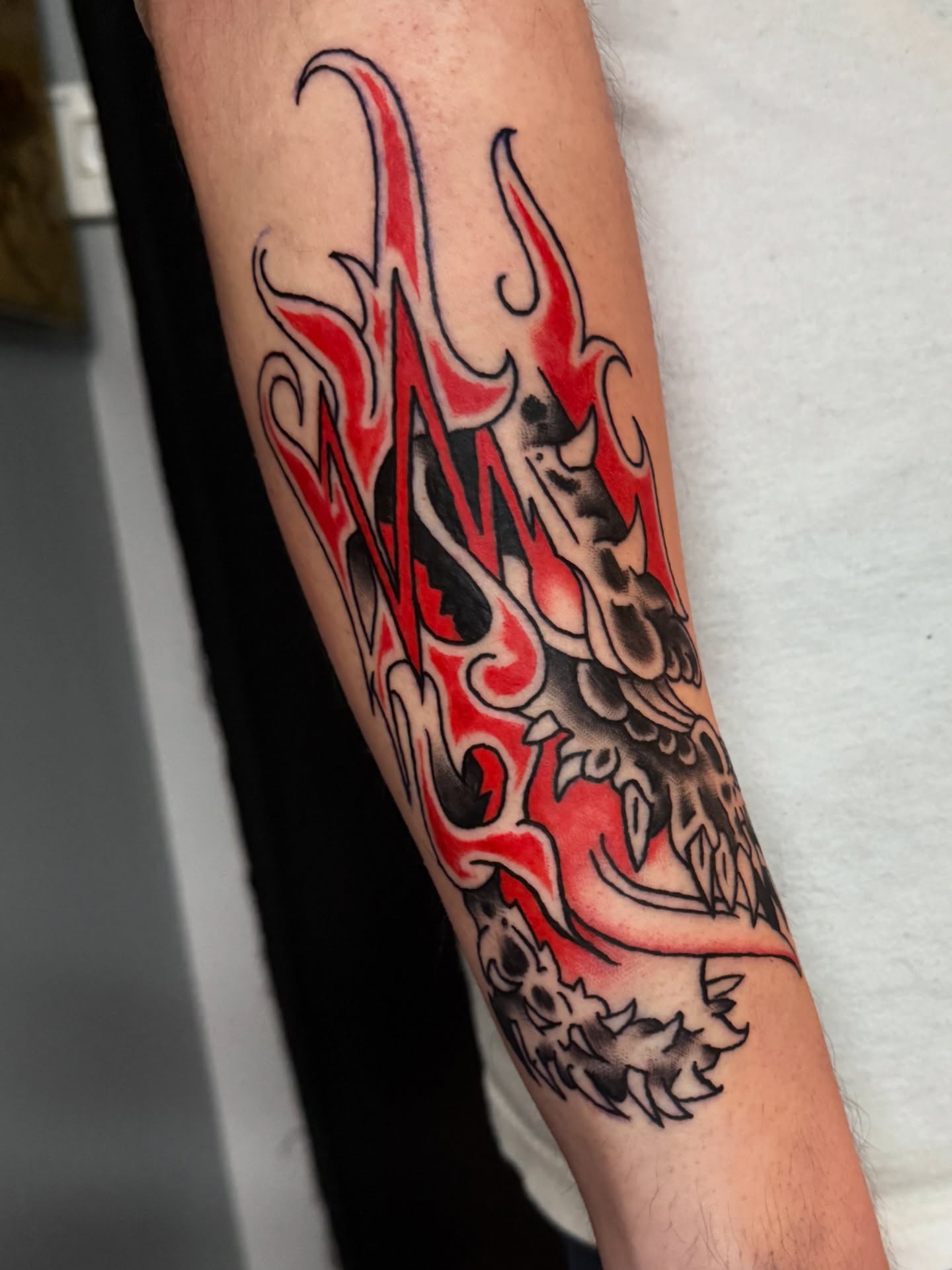 Flame japanese irezumi tattoo on the forearm by Gabe Rosen