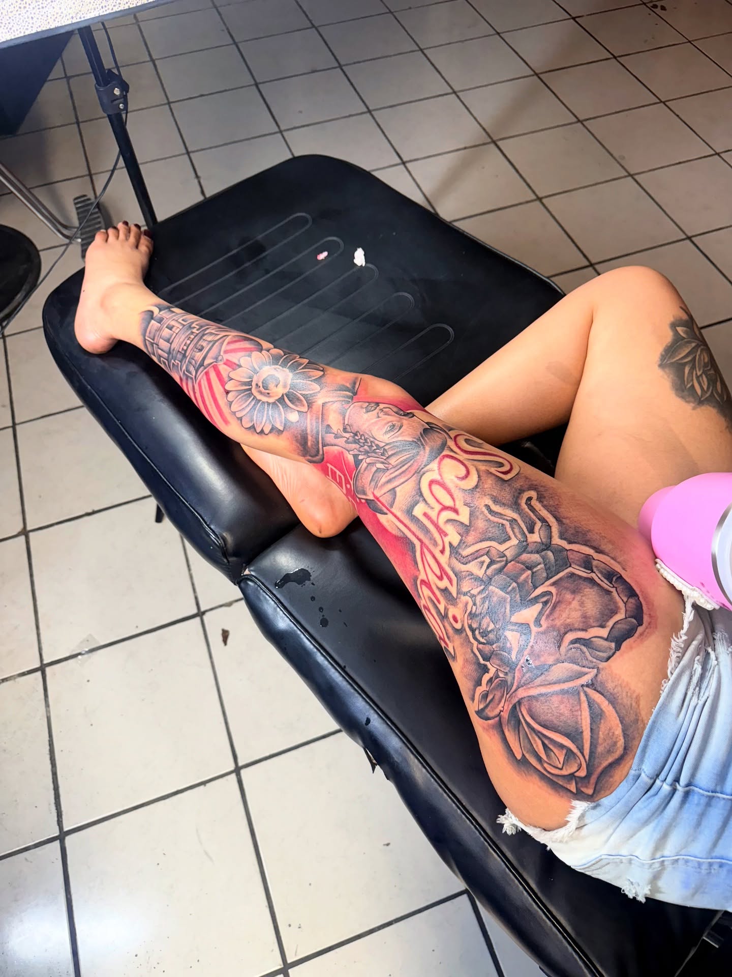 Floral and mythological American traditional tattoo on the leg by GrindHard Quen