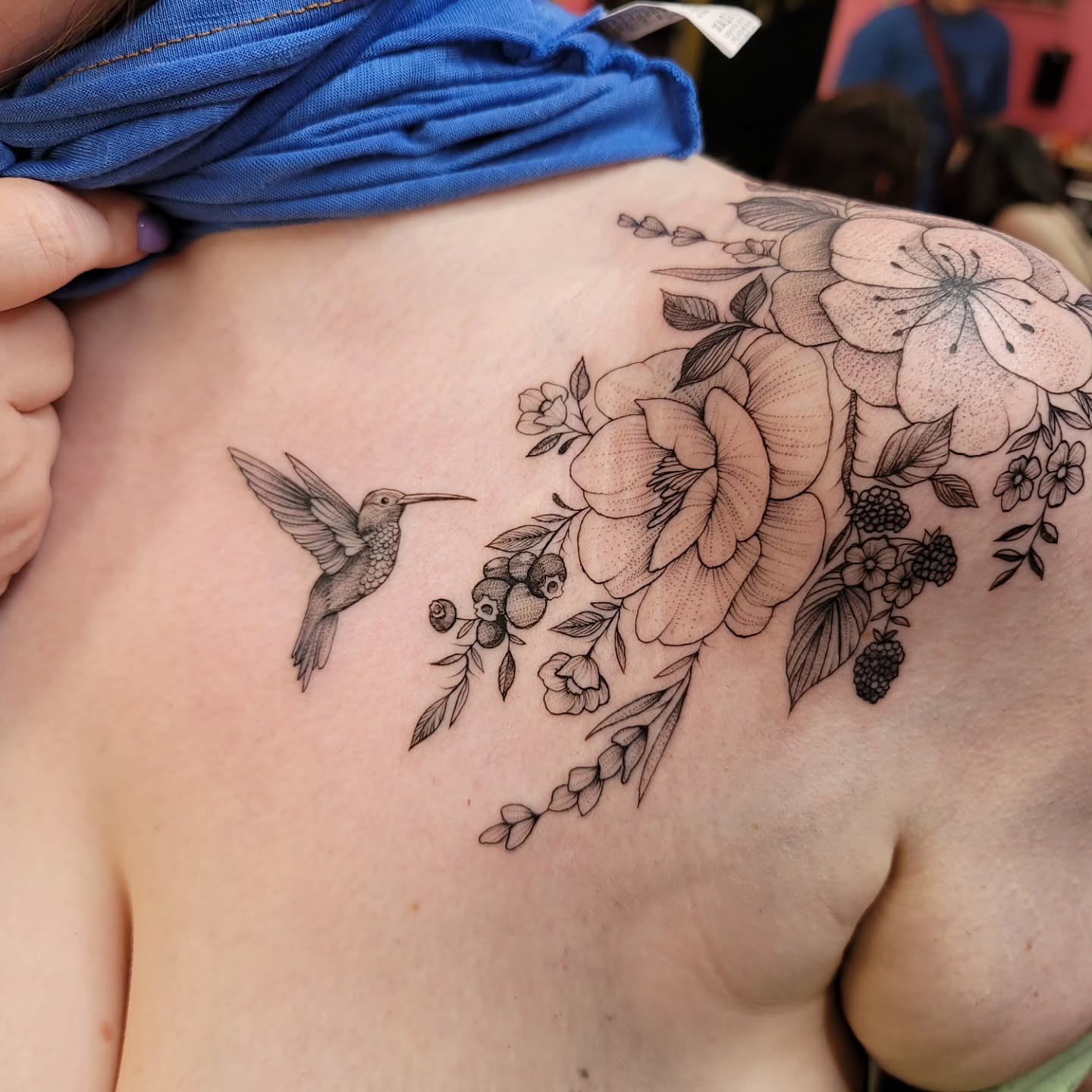 Hummingbird and floral bouquet dotwork tattoo on the shoulder by Mary Lefeau