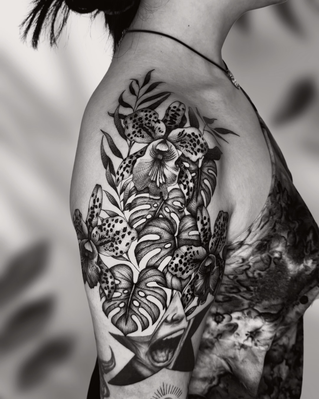 Floral arrangement dotwork tattoo on the shoulder by Ingrid Rojas
