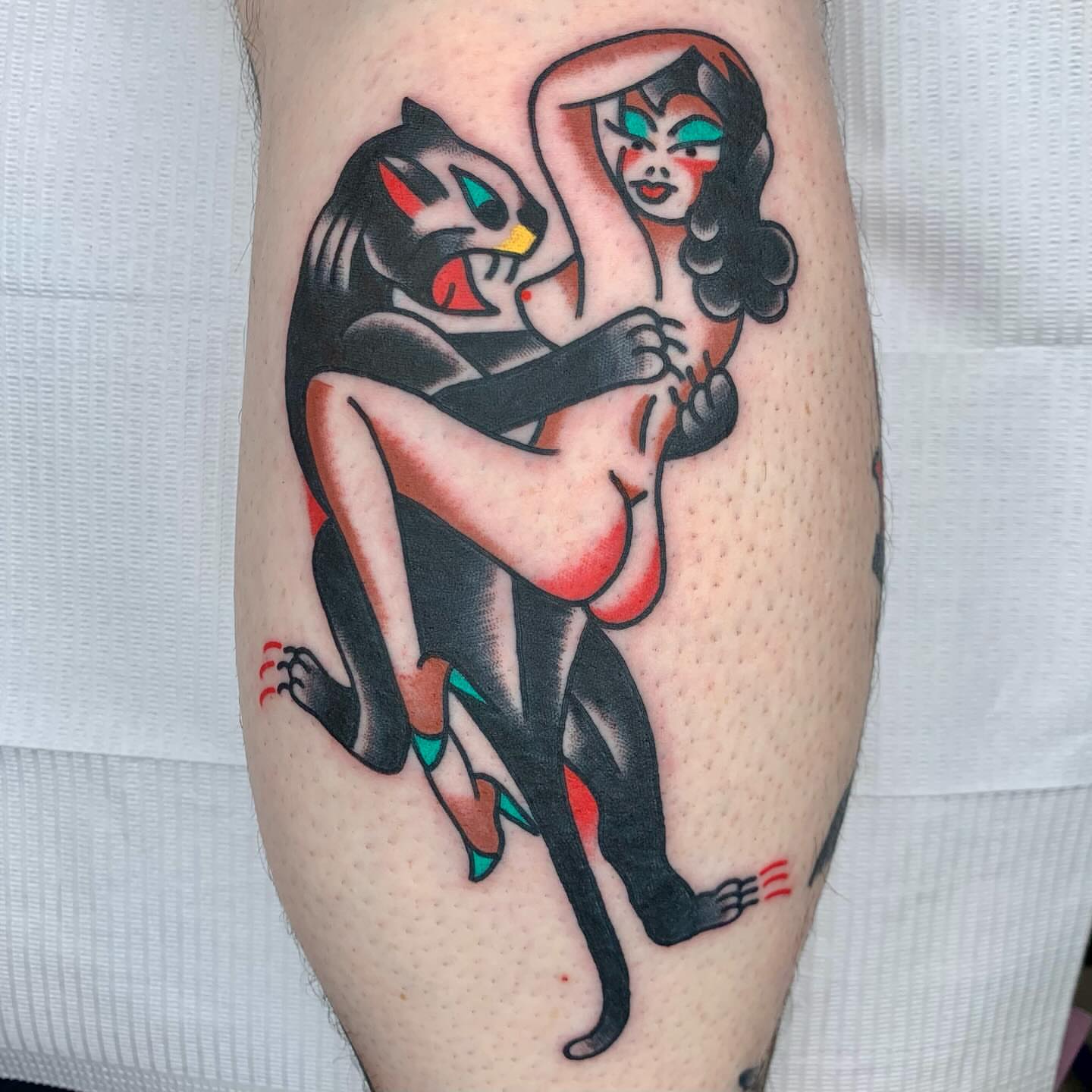 Cat and woman American traditional tattoo on the forearm by Keegan Bergen