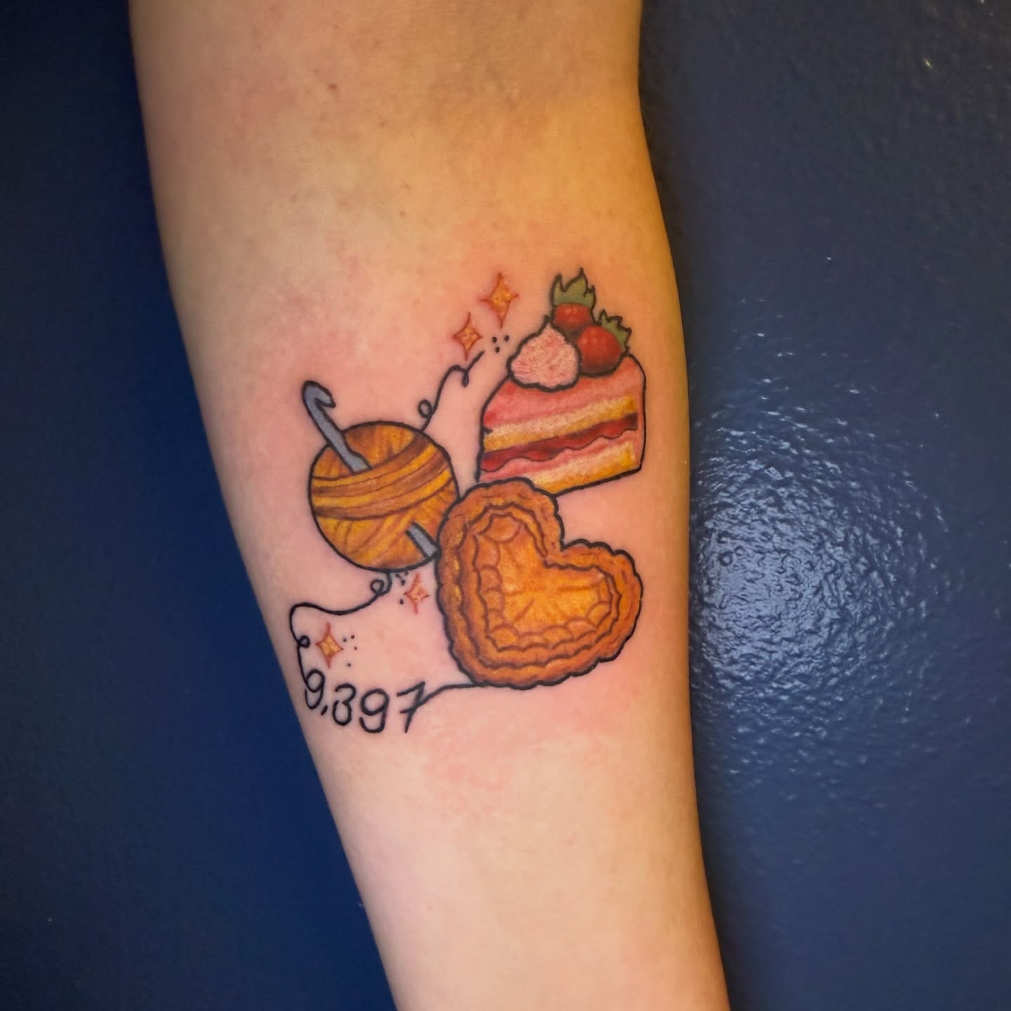Astronomy-themed dessert illustrative tattoo on the forearm by Maggie De La Torre ๐ณ๏ธโโง๏ธ๐ฒ๐ฝ