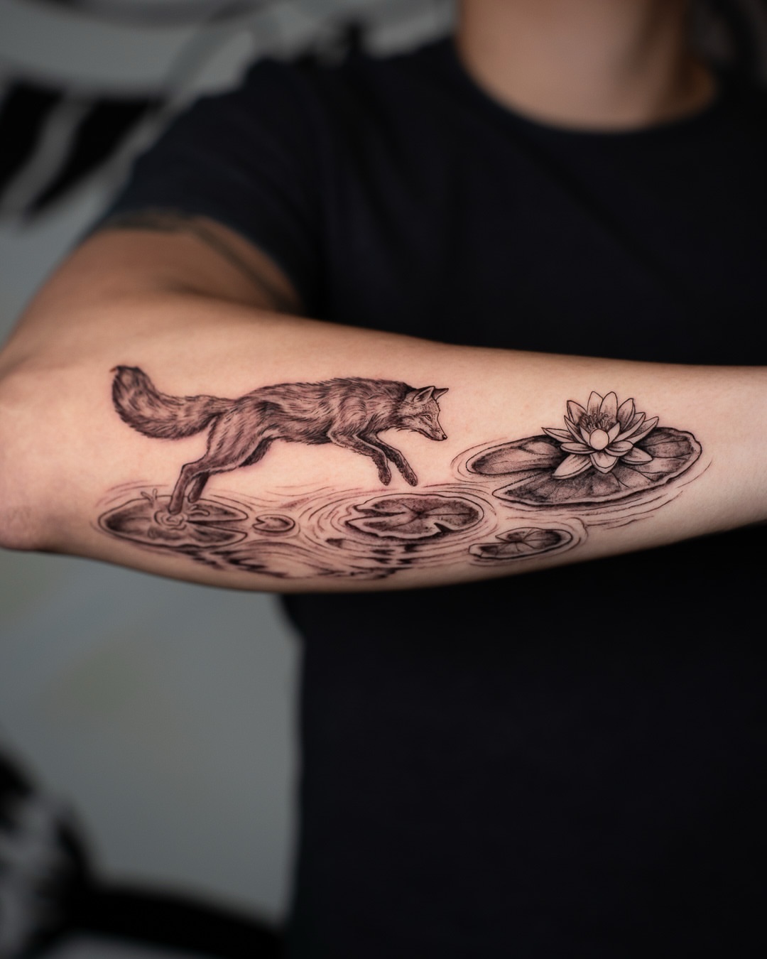Fox and lily pad black and grey tattoo on the forearm by Tattoo Artist Bay Area - Lorenzo, Berkeley, California