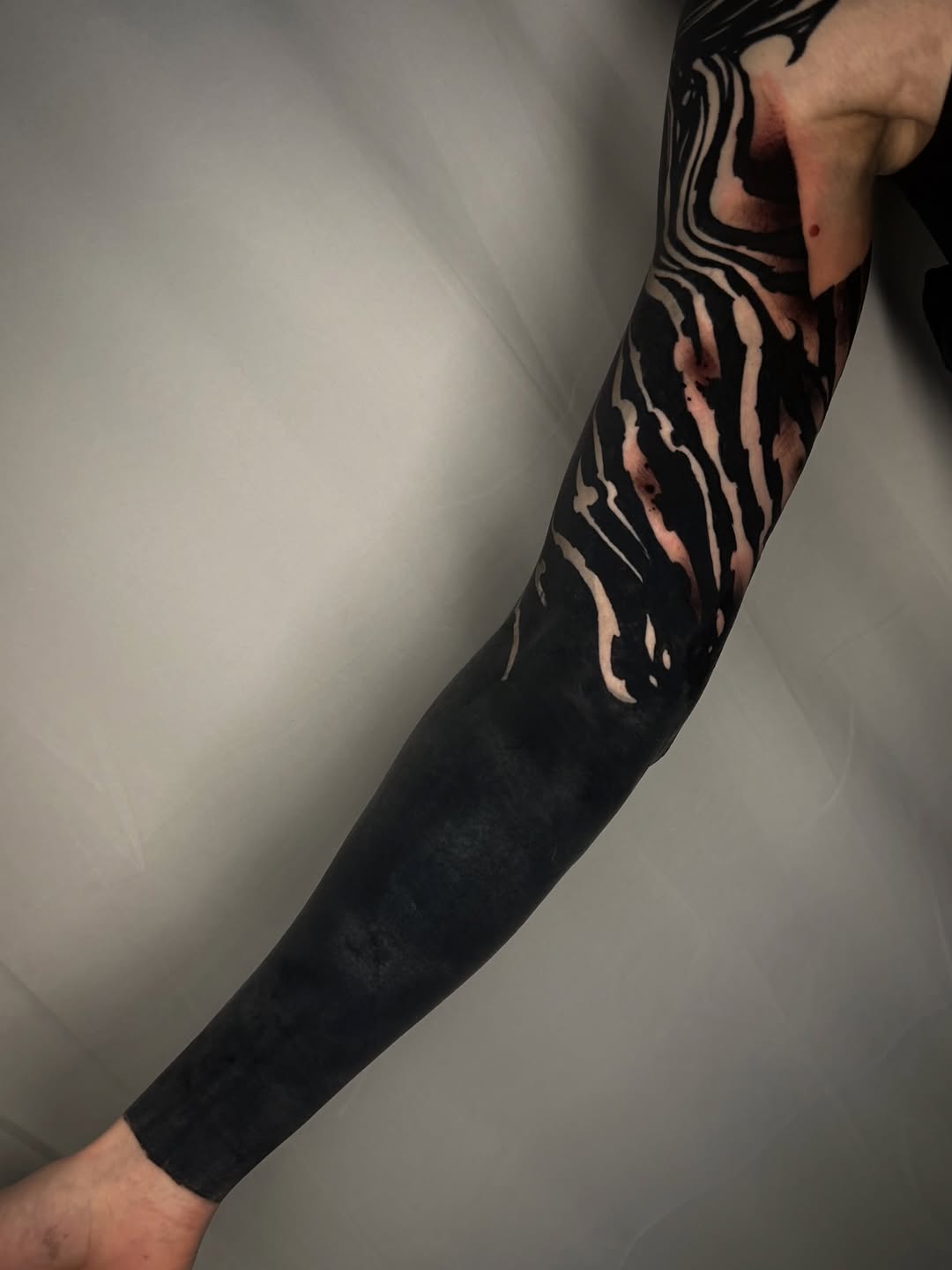 Abstract blackwork sleeve tribal tattoo on the upper arm by S C A B B e R W O C K y
