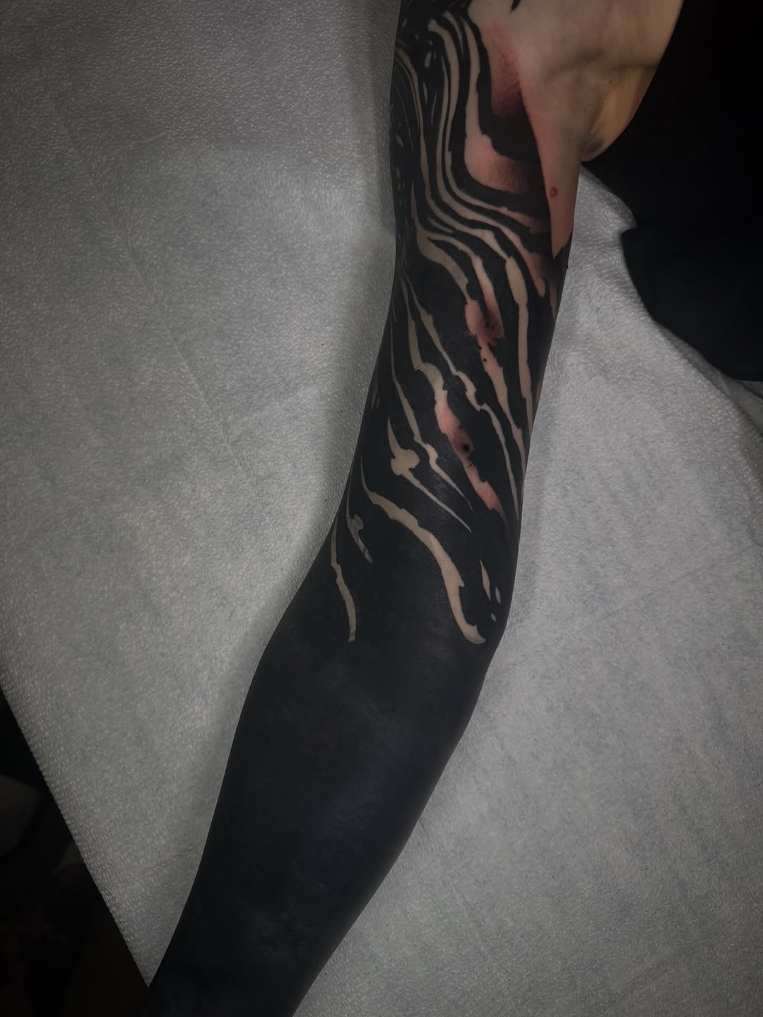 Abstract pattern blackwork tattoo on the forearm by S C A B B e R W O C K y