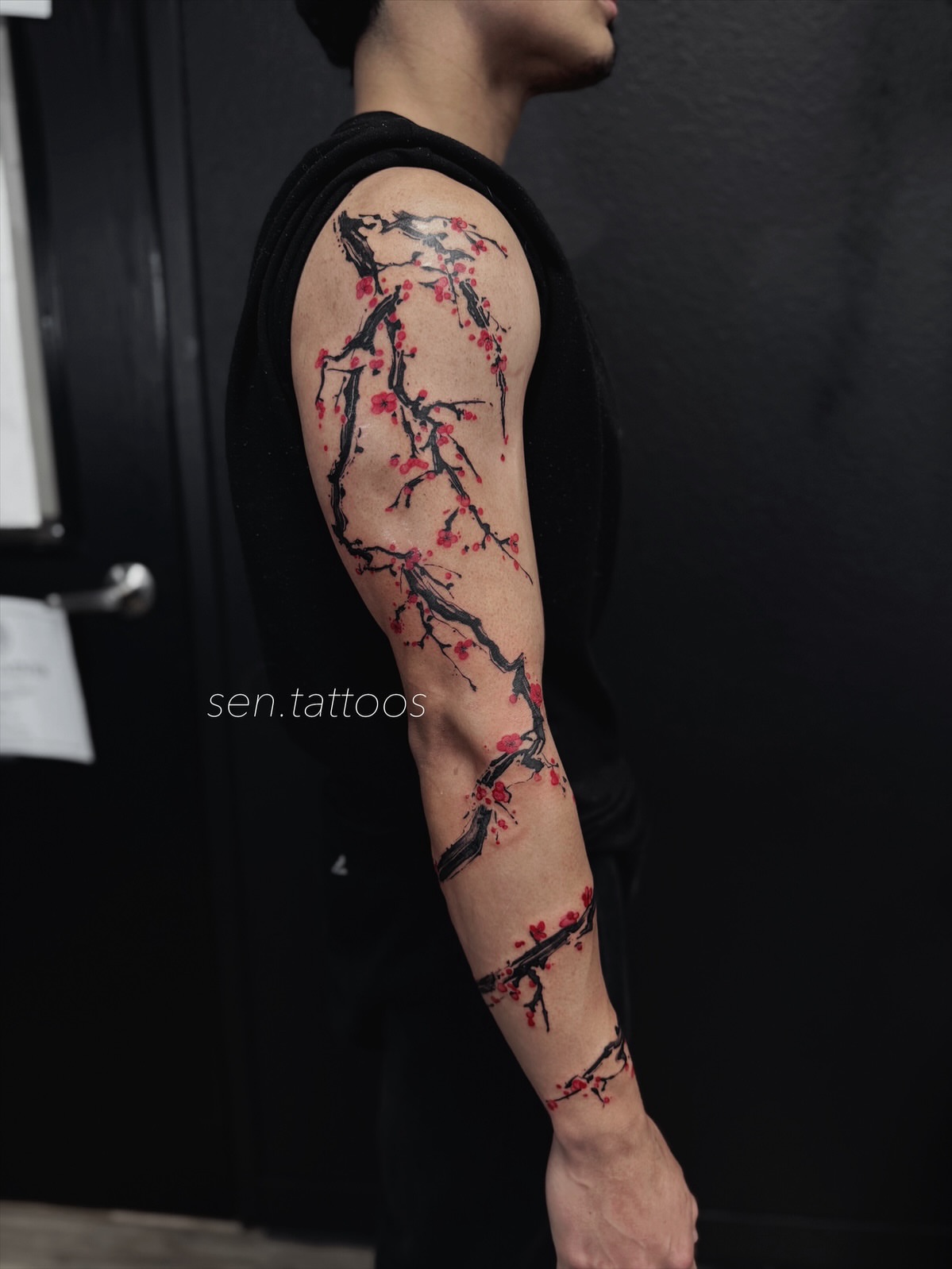 Cherry blossom branches dotwork tattoo on the forearm by Sen Tattooer
