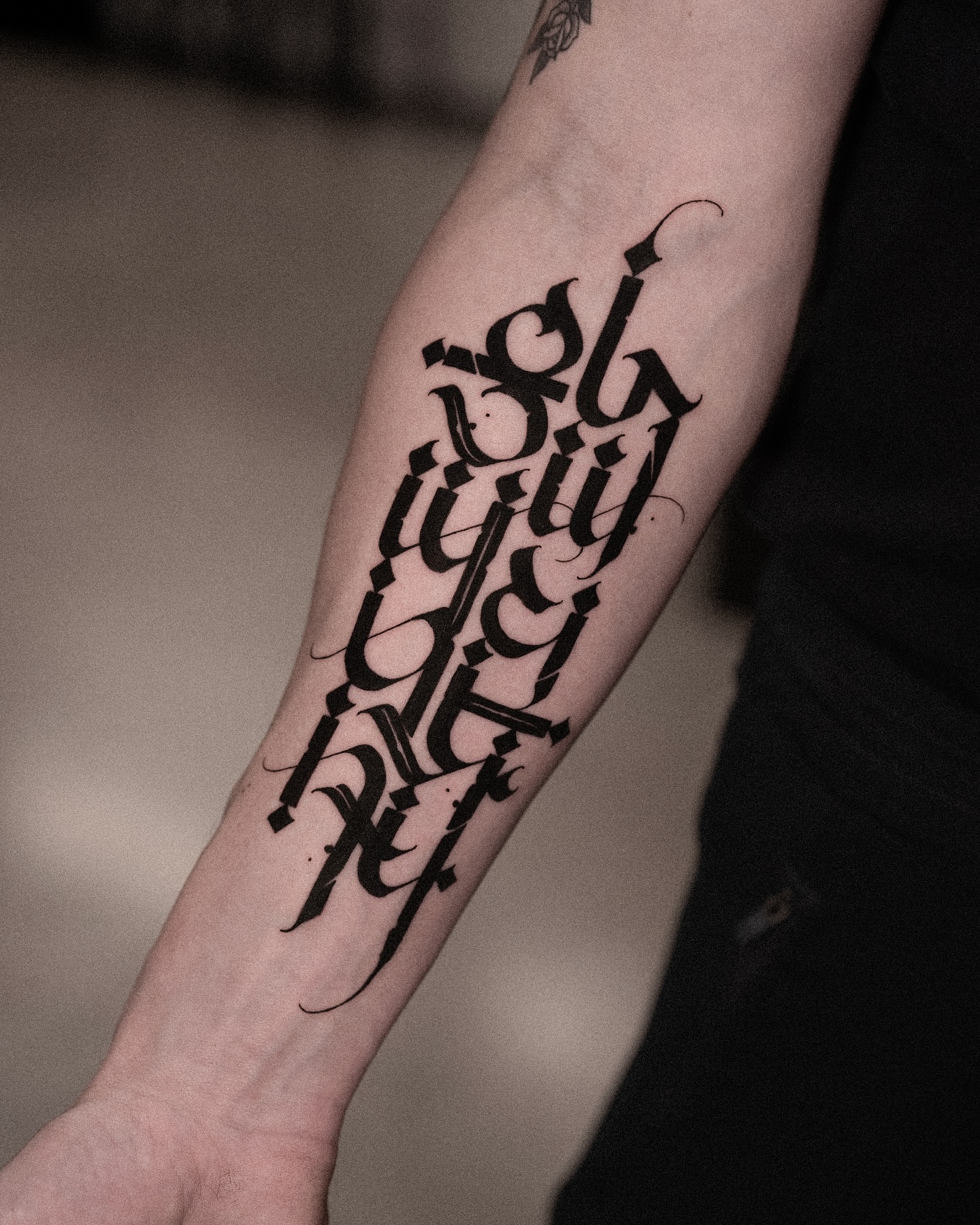 Calligraphy text cyber sigilism tattoo on the forearm by Low, Brooklyn, New York