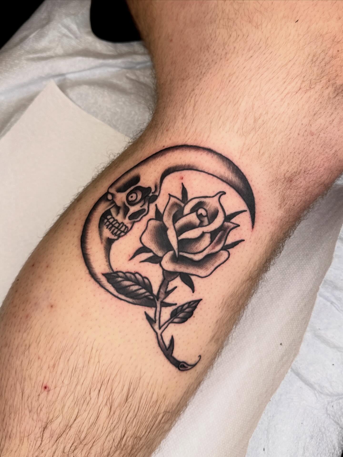 Rose and skull black and grey tattoo on the forearm by Meg Nefcy, Milford, Michigan