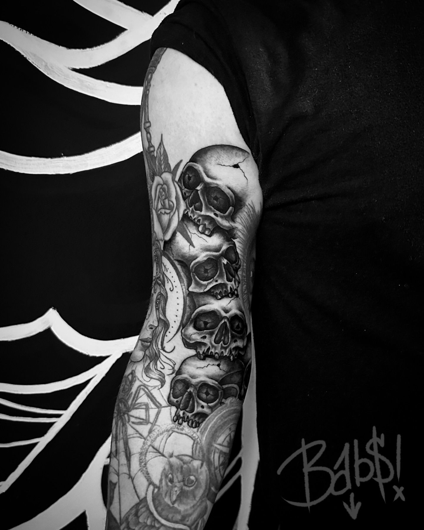 Skulls and roses realism tattoo on the forearm by Justin B