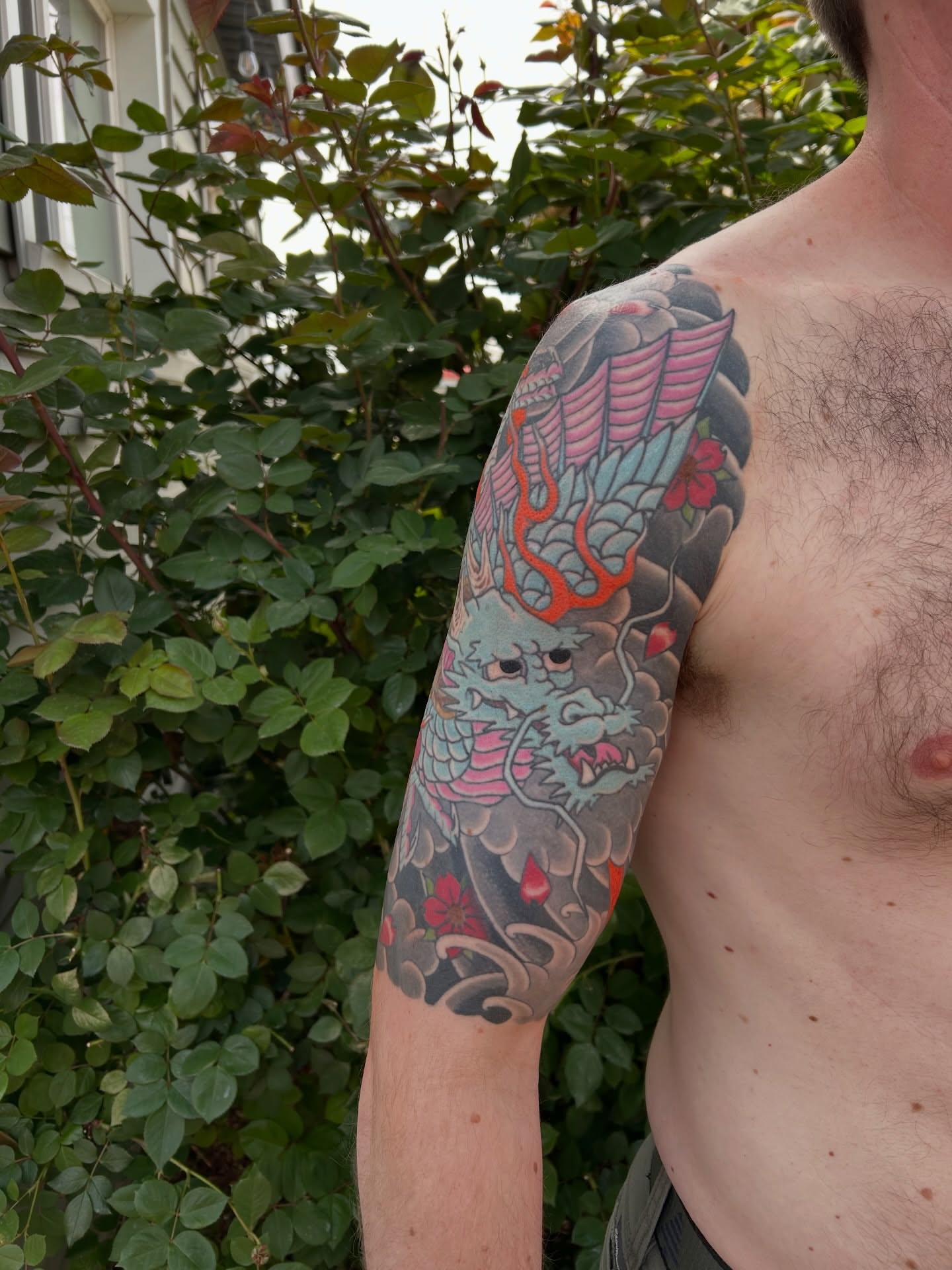 Dragon japanese irezumi tattoo on the upper arm by Mike "Yogi" Trube
