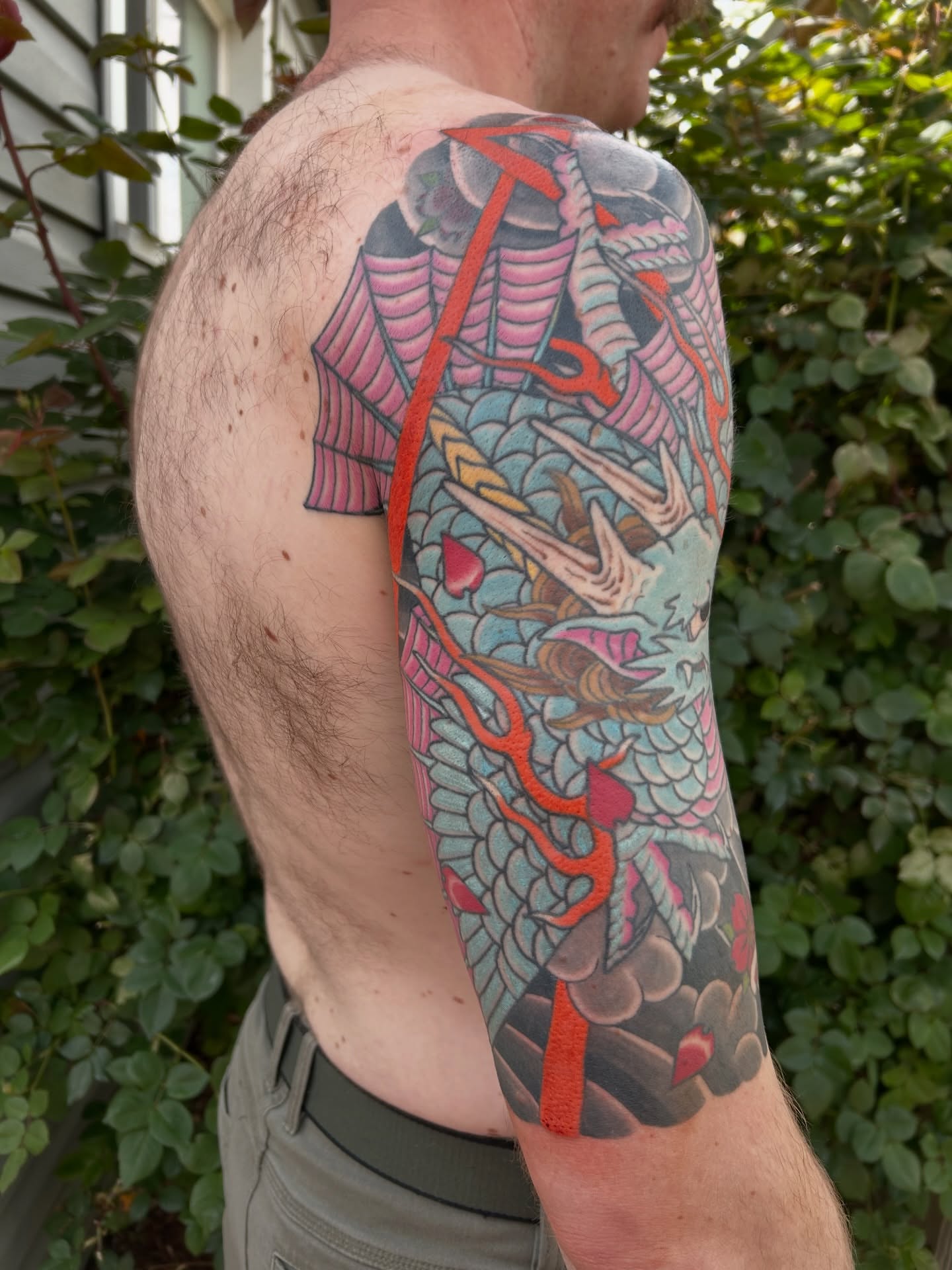 Dragon japanese irezumi tattoo on the upper arm by Mike "Yogi" Trube