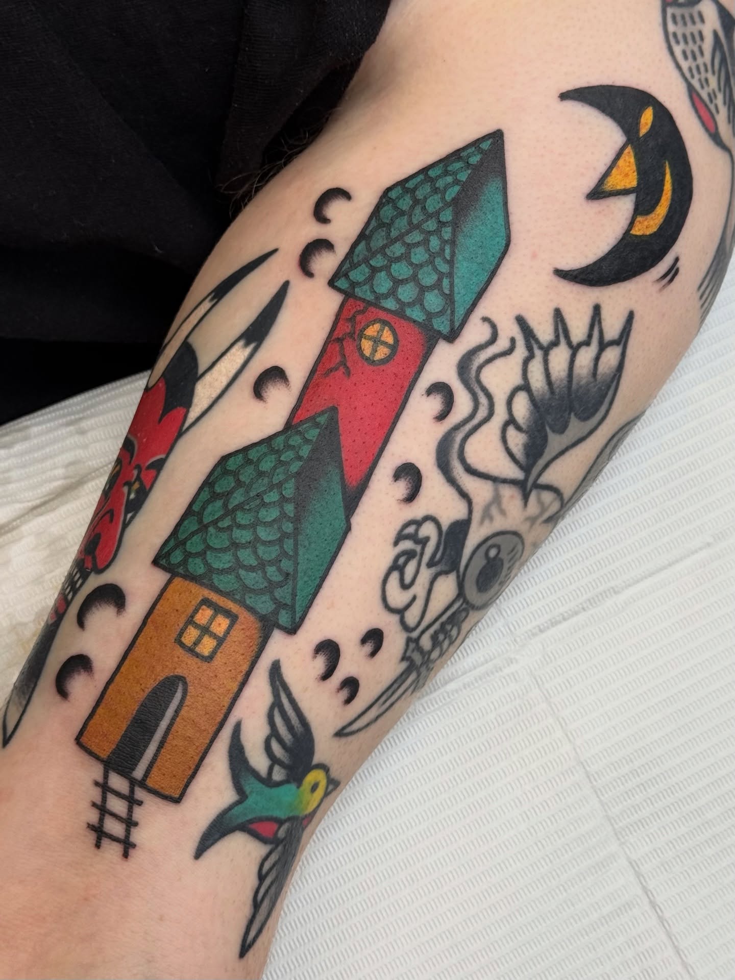 House and rocket American traditional tattoo on the forearm by Roman