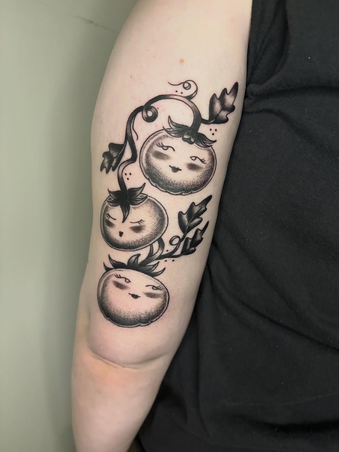 Anthropomorphic tomatoes dotwork tattoo on the forearm by Fin :