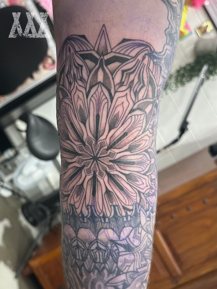 Geometric mandala geometric tattoo on the forearm by Lyndsay Southgate