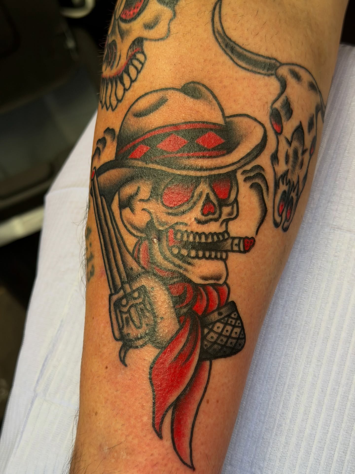 Skull wearing cowboy hat American traditional tattoo on the forearm by @ryanpereztattoo