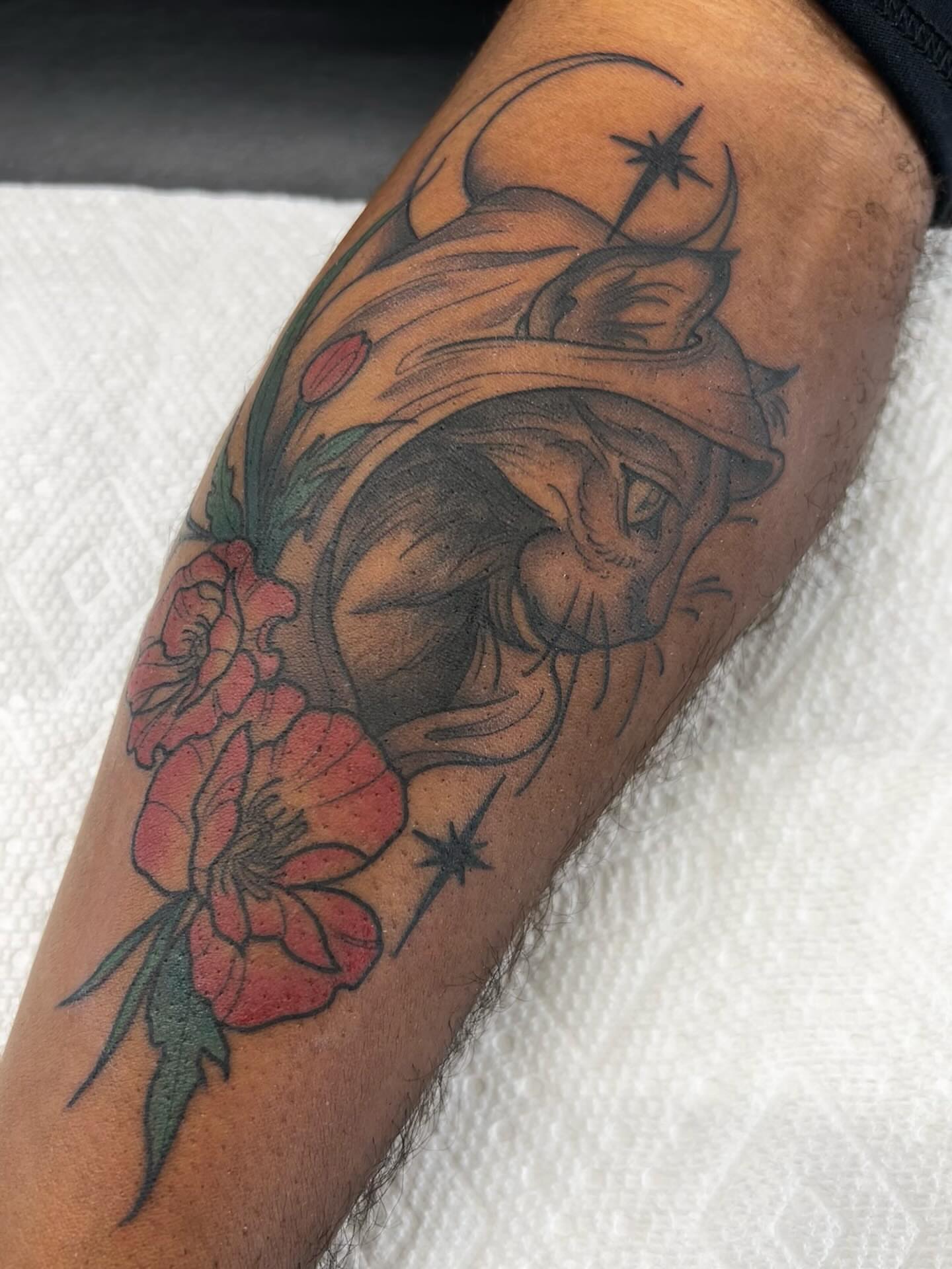 Cat and flowers American traditional tattoo on the forearm by Kayla Fay, Baton Rouge, Louisiana