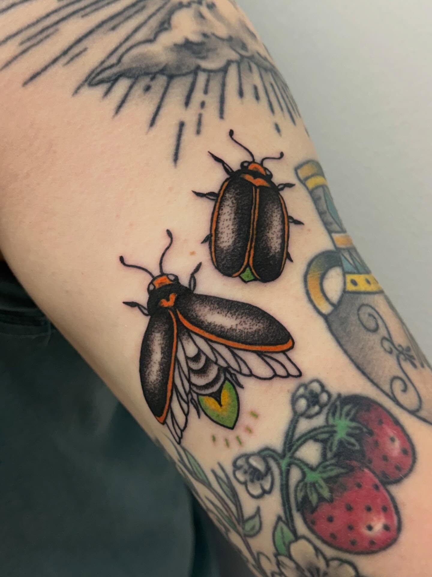 Fireflies American traditional tattoo on the forearm by Gigi