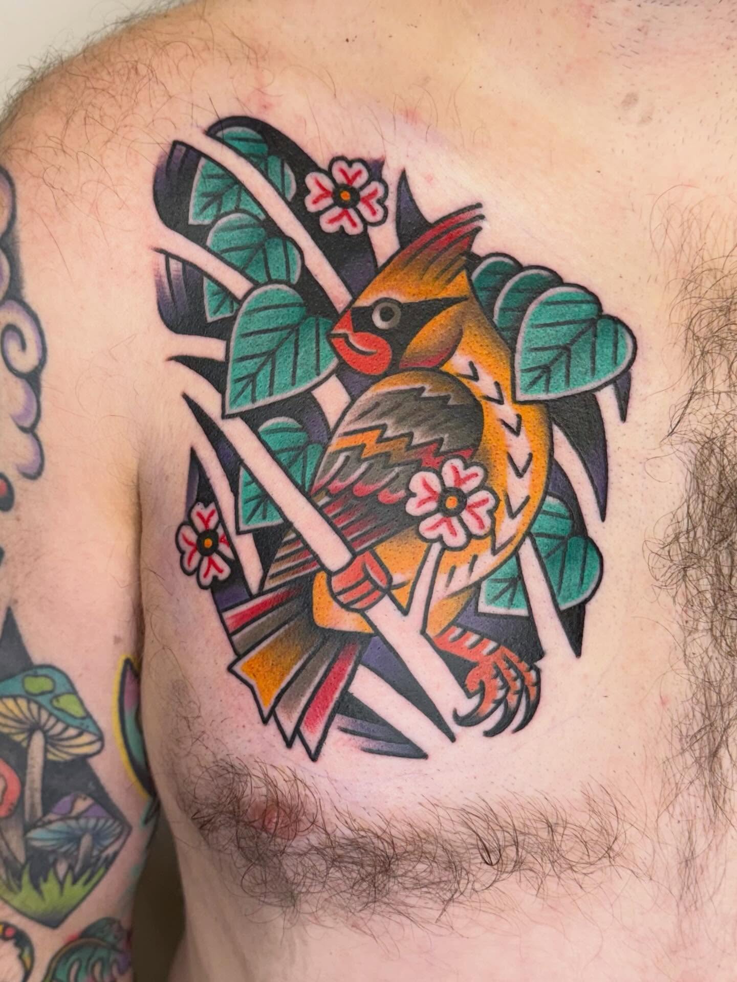 Cardinal bird American traditional tattoo on the chest by Matt Paw