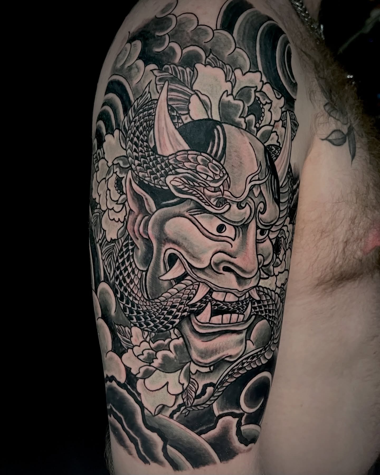 Demon mask with snake japanese irezumi tattoo on the forearm by EO, Chicago, Illinois