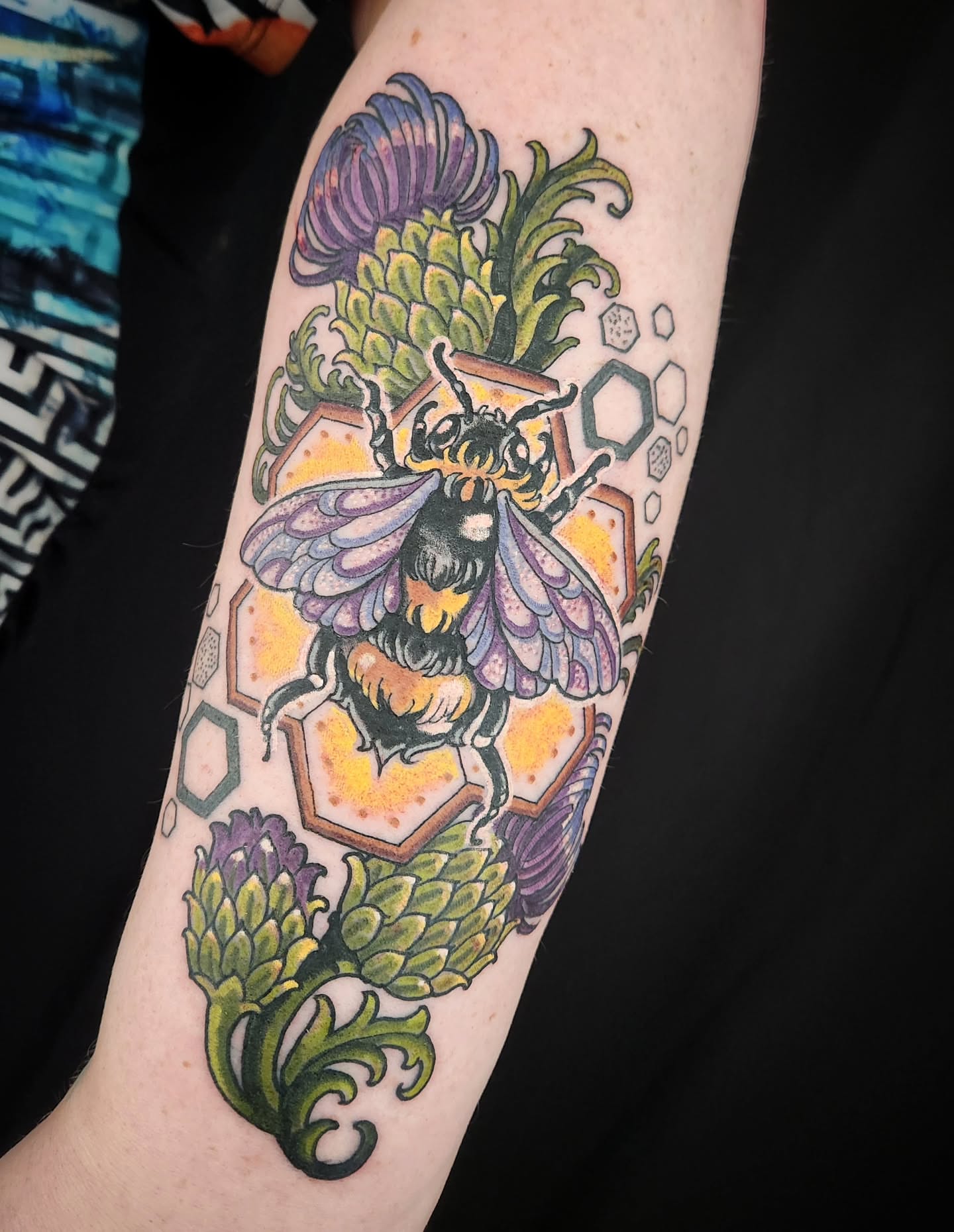 Bee and thistle geometric tattoo on the forearm by Randy
