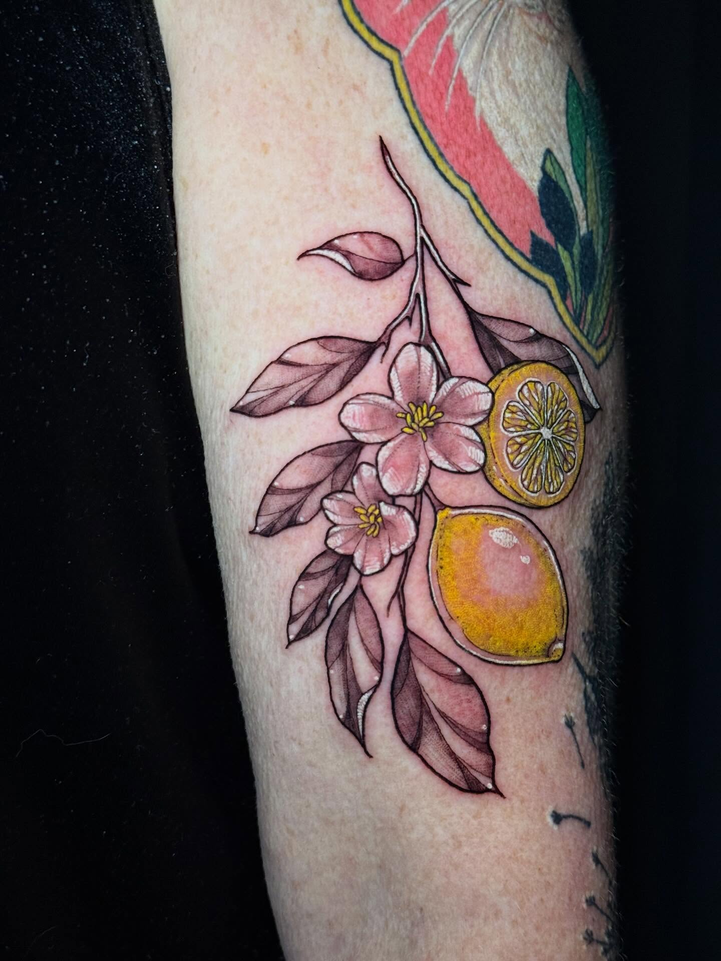 Lemon and flowers new school tattoo on the forearm by Andreanna Rosemarie Gabranidis, Pennsauken, New Jersey