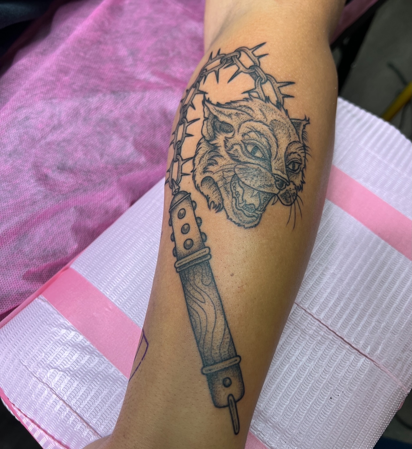 Cat and dagger realism tattoo on the forearm by Bri Leflore