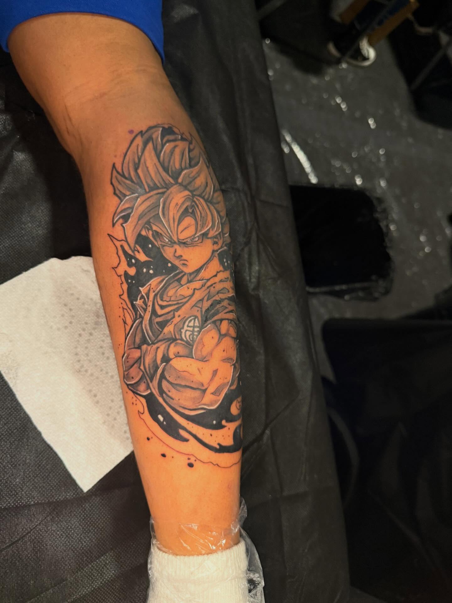 Son goku anime tattoo on the forearm by InkdByHendrixx