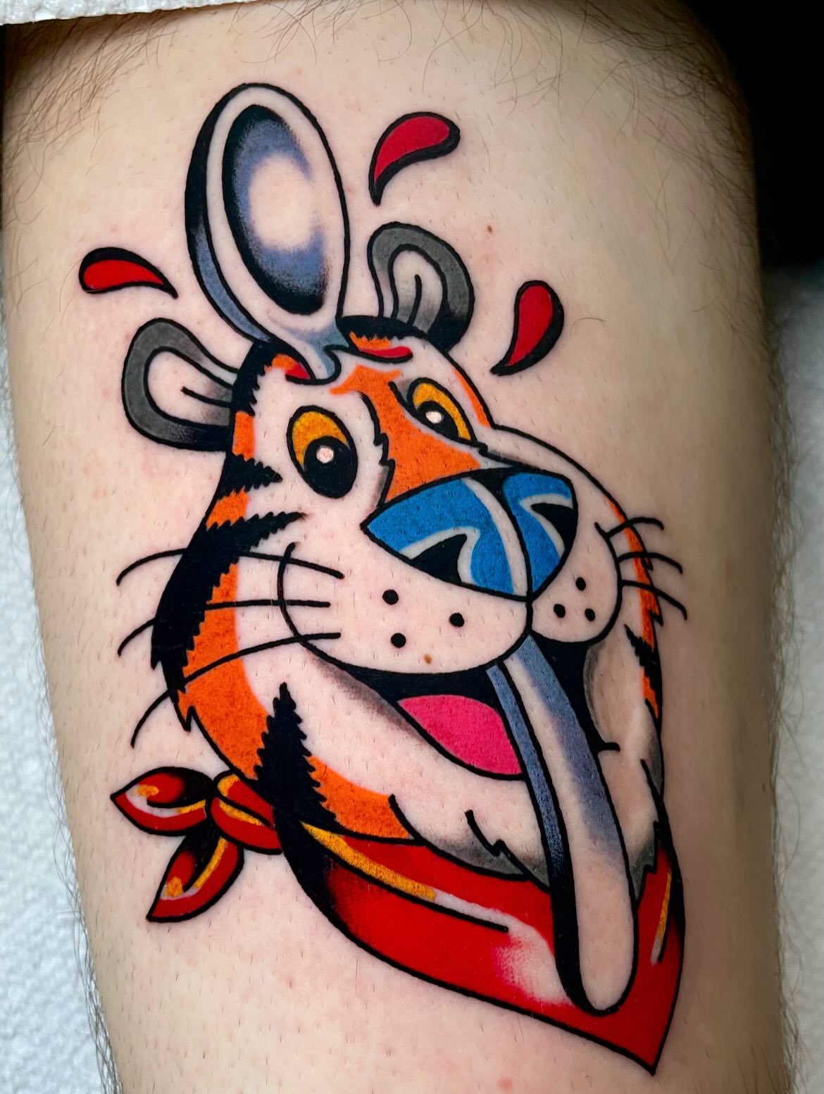 Tiger American traditional tattoo on the thigh by Ryan McDonald