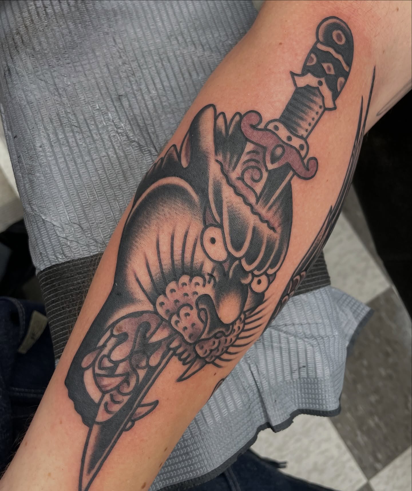 Sword and dragon realism tattoo on the forearm by matt nelson