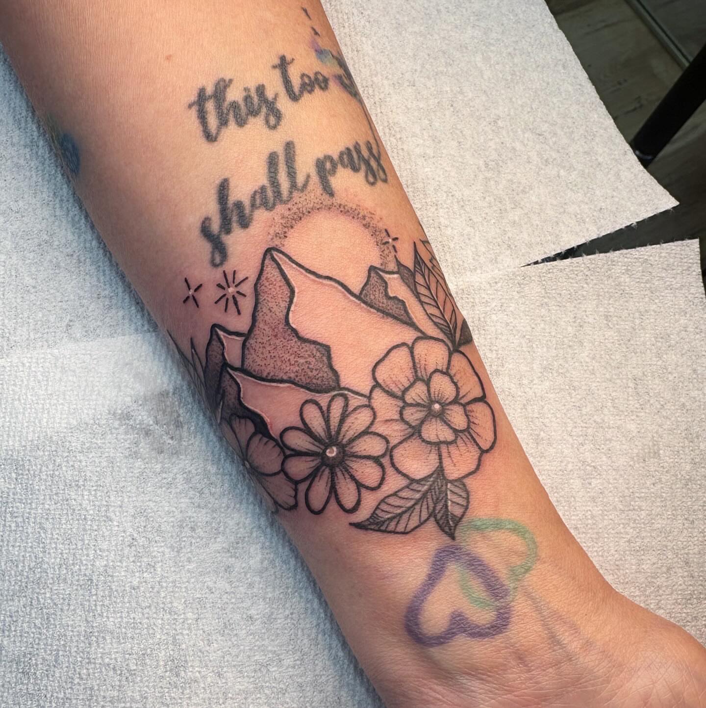Mountain and flowers black and grey tattoo on the forearm by Demi Flores 🖤