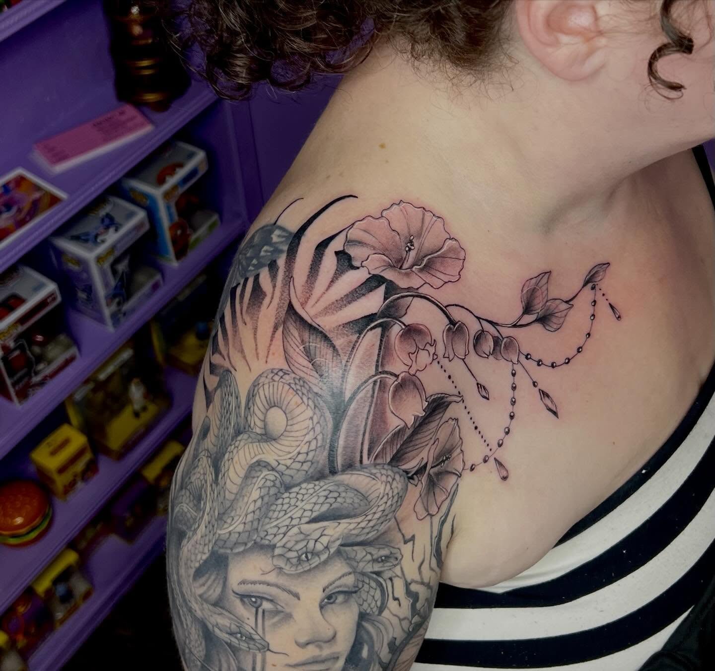 Snake and peony realism tattoo on the shoulder by Ebony Robinson, Austintown, Ohio