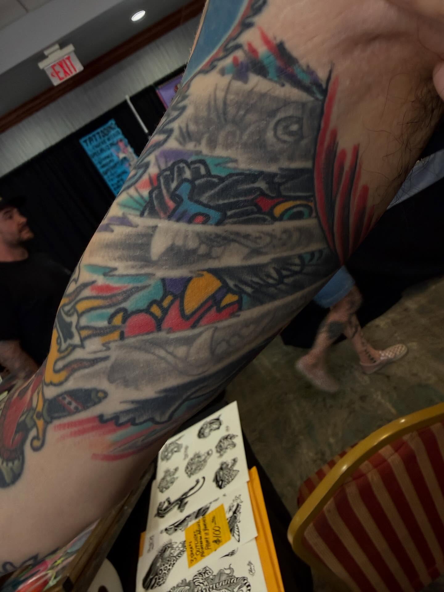 Abstract art American traditional tattoo on the upper arm by Mike Wilson