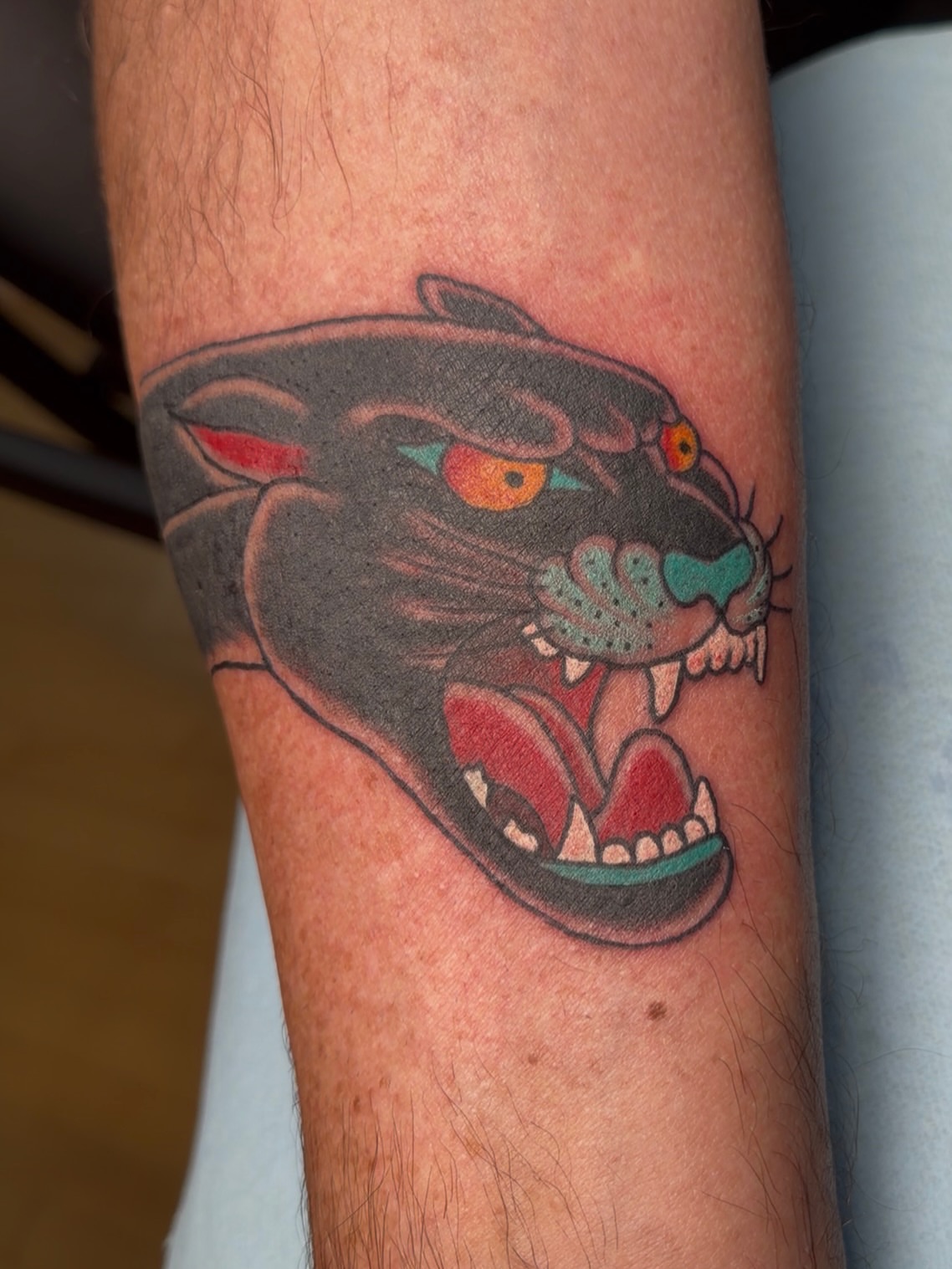 Panther American traditional tattoo on the forearm by Trevor Berry